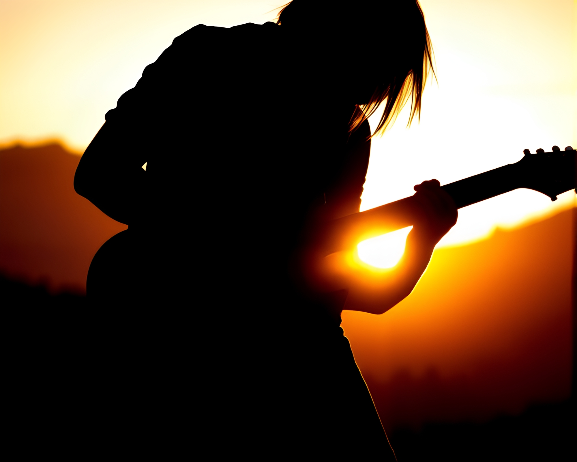 Guitarist Silhouetted in Glowing Crosshatch Sunset – free AI stock image