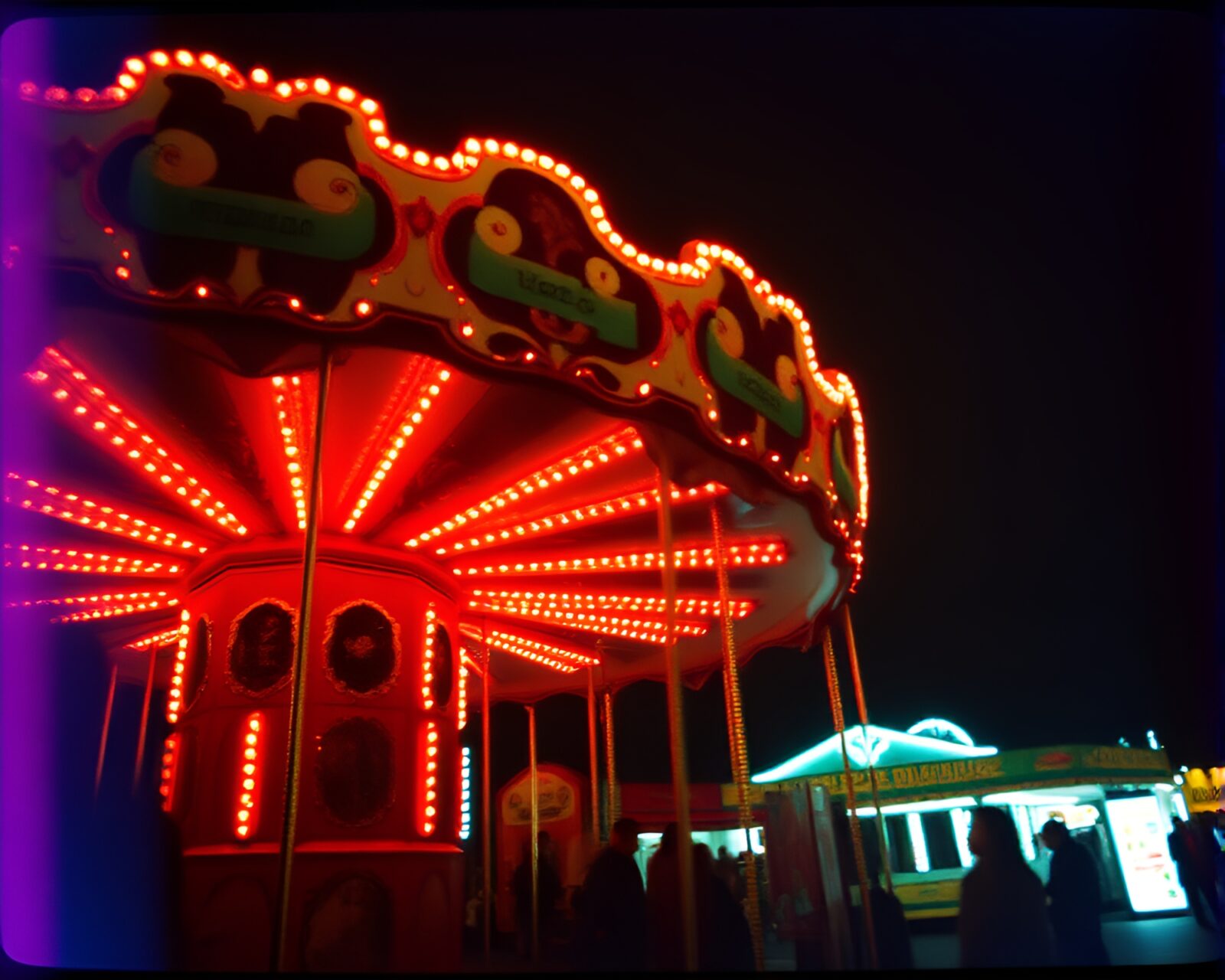 Colorful carousel ride with whimsical lighting effects at night