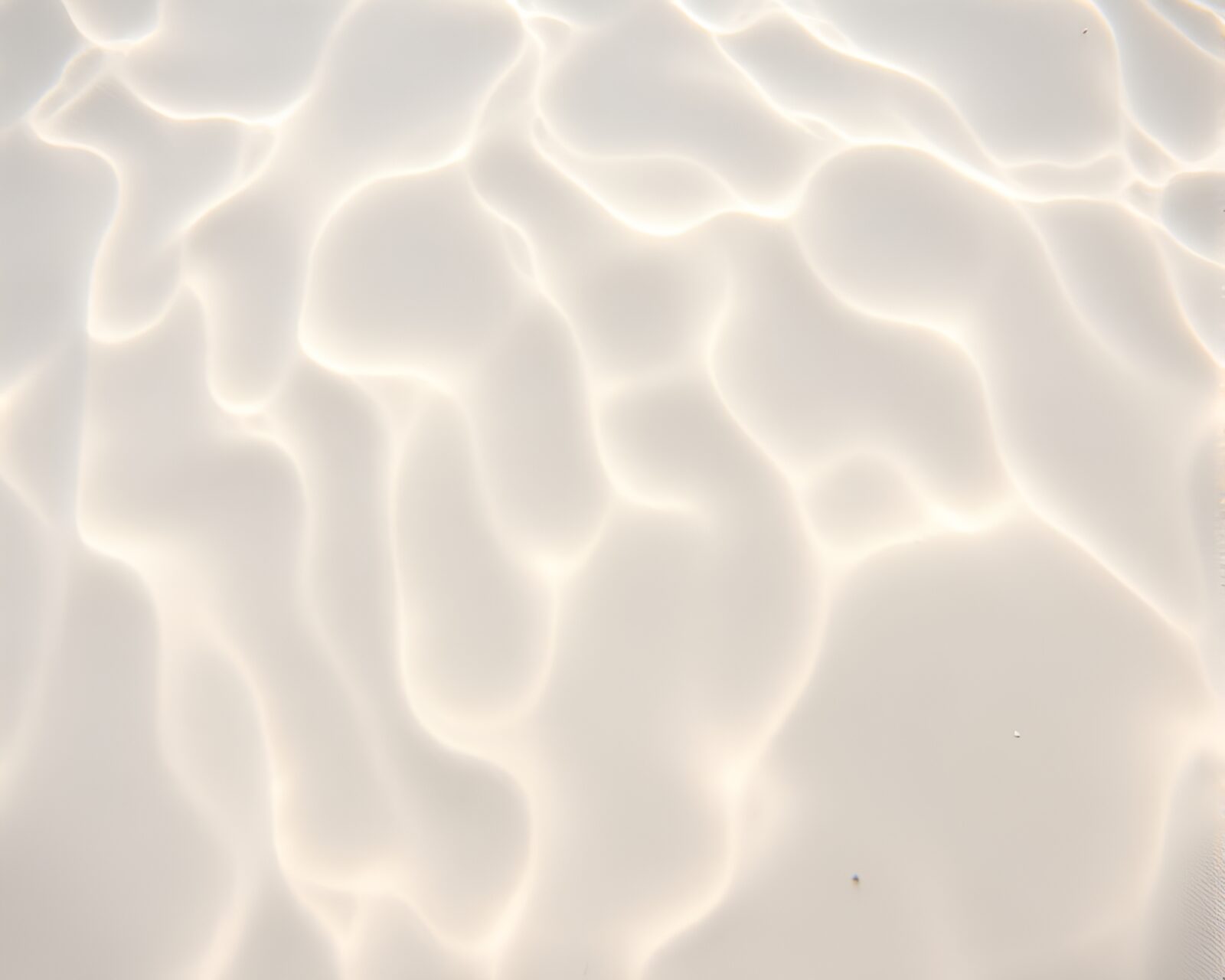 Pastel-toned underwater scene with intricate sand swirls
