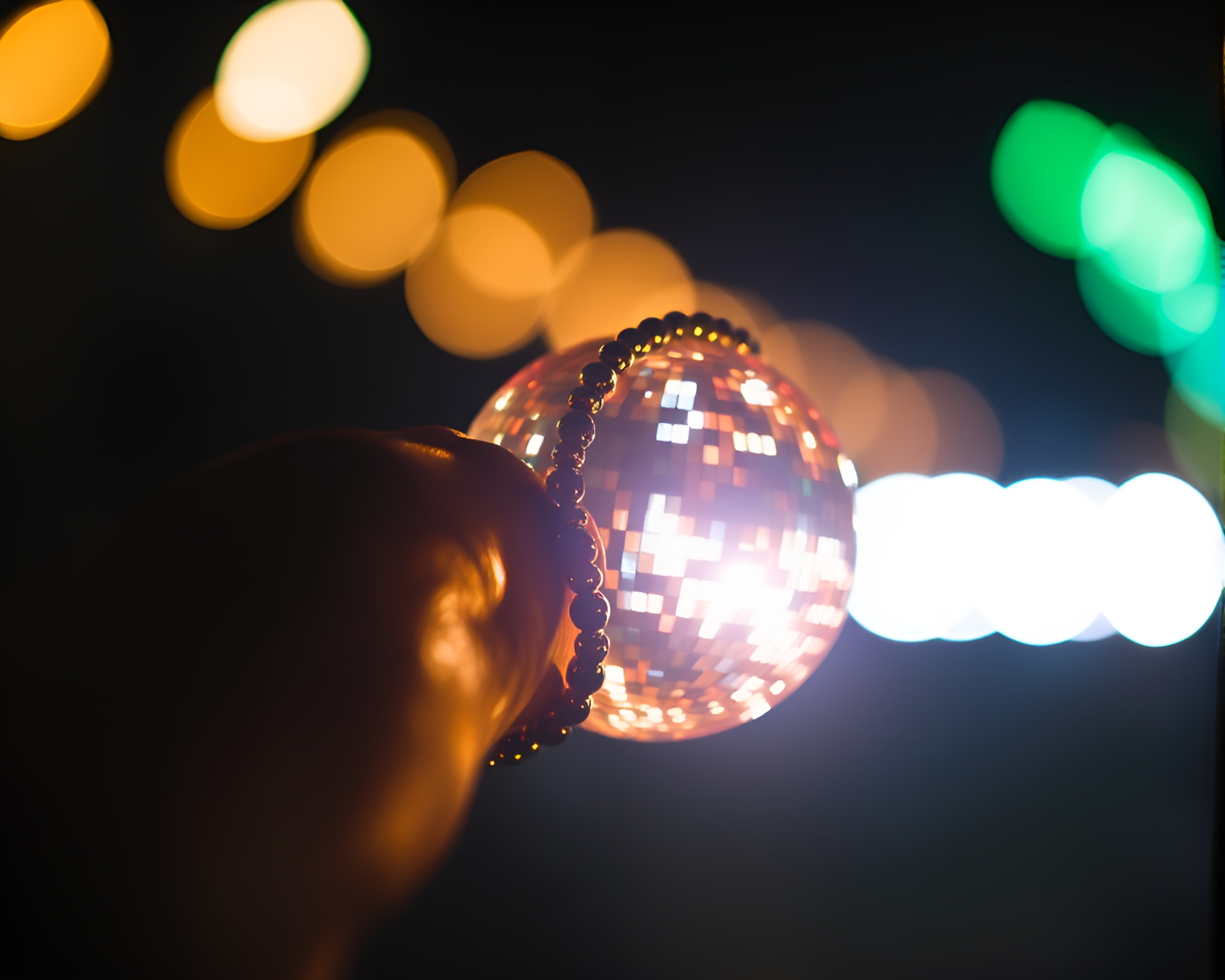 Glimmering disco bracelet in long exposure light leaks – free AI stock image
