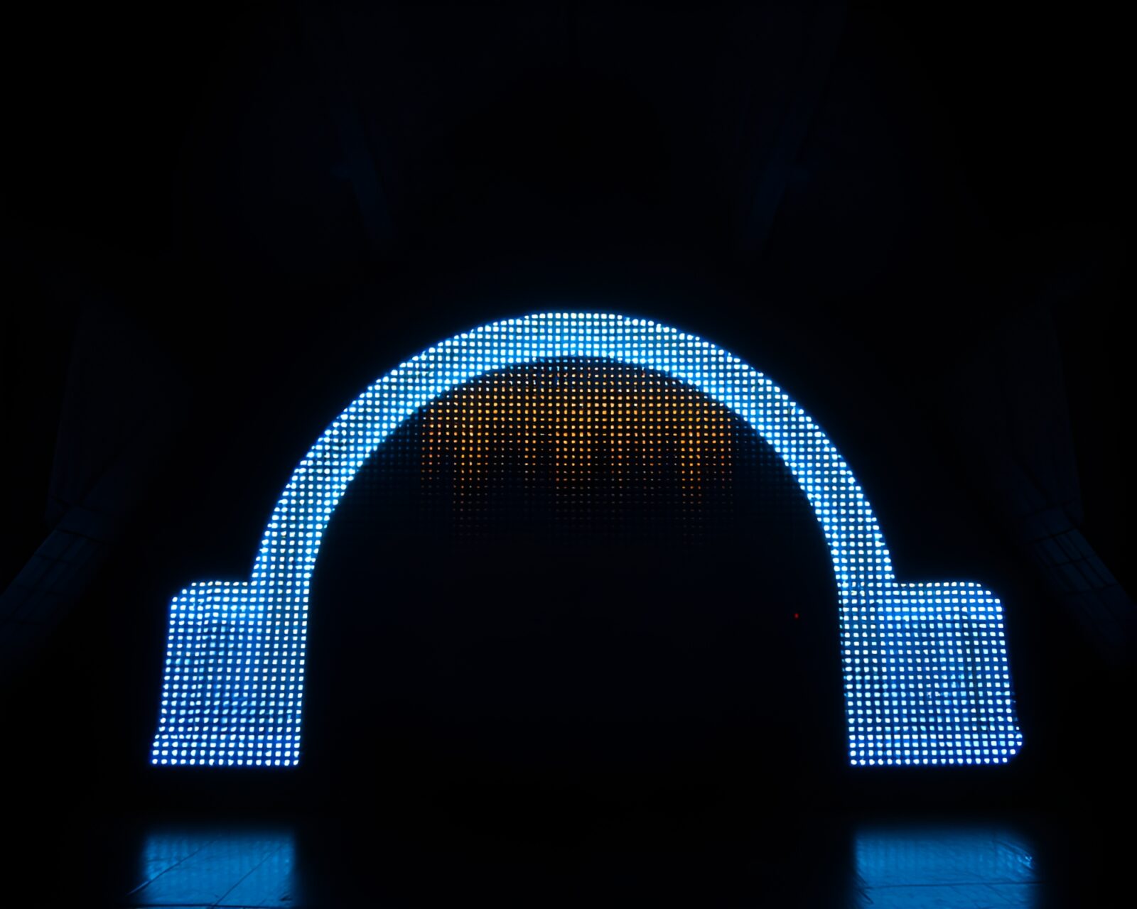 Eerie attic scene with arch bridge and LED pixel grid