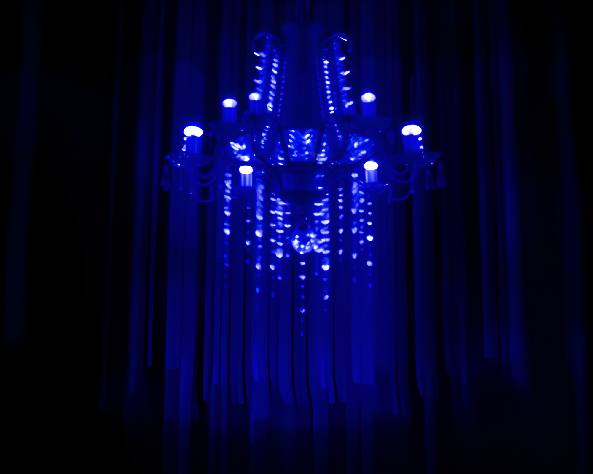 Ethereal Crystal Chandelier Silhouette in Indigo Motion Blur – free AI stock image