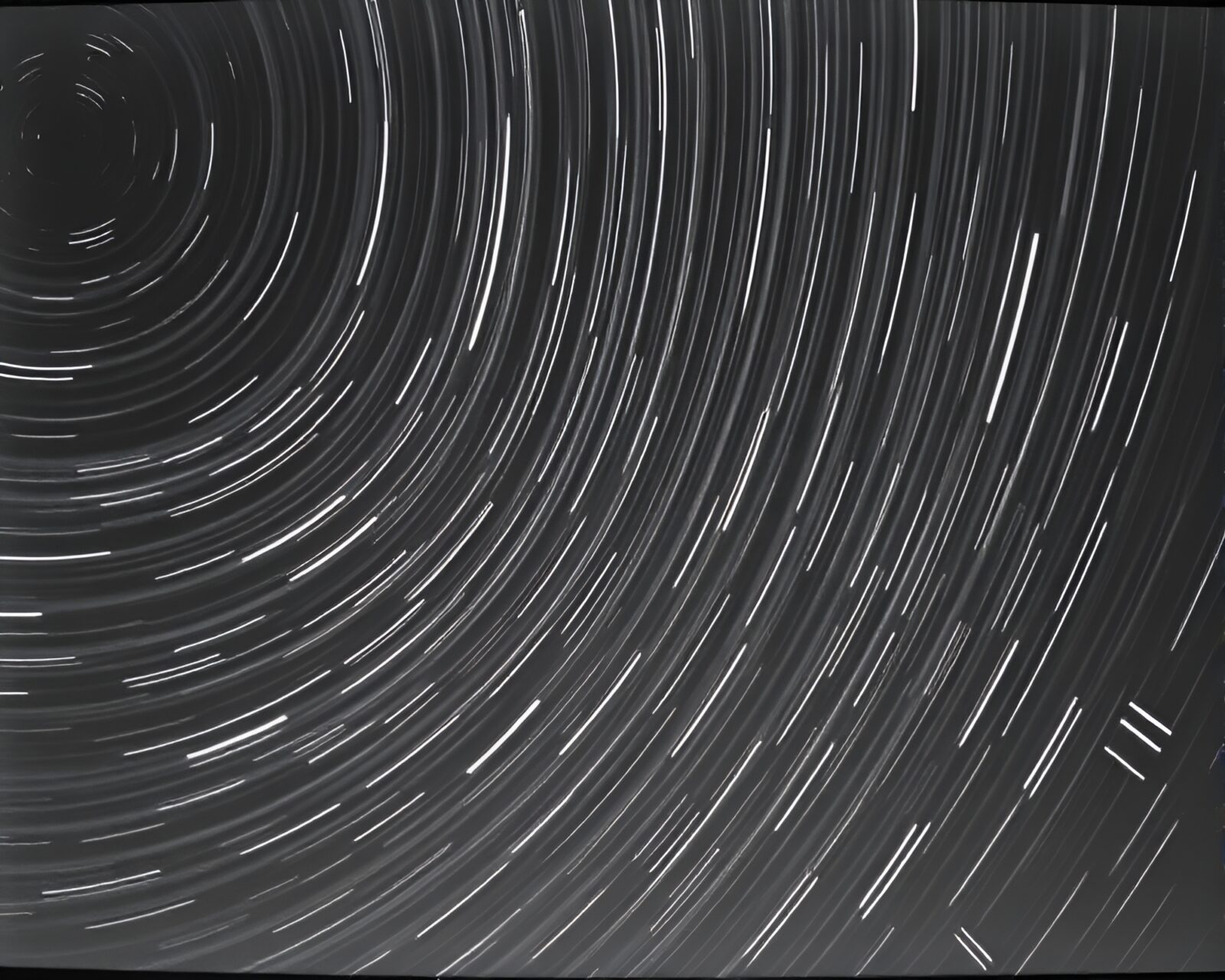 Surreal black and white stars swirling in distortion