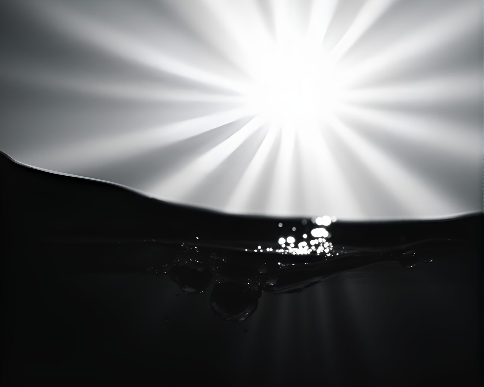 Abstract image of sunrays reflecting on rippling water surface