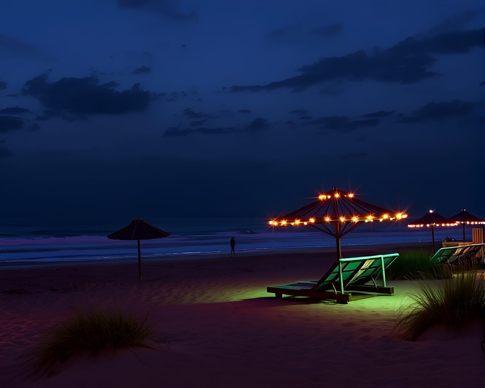 Vibrant LED pixel grid illuminating a beach at night.