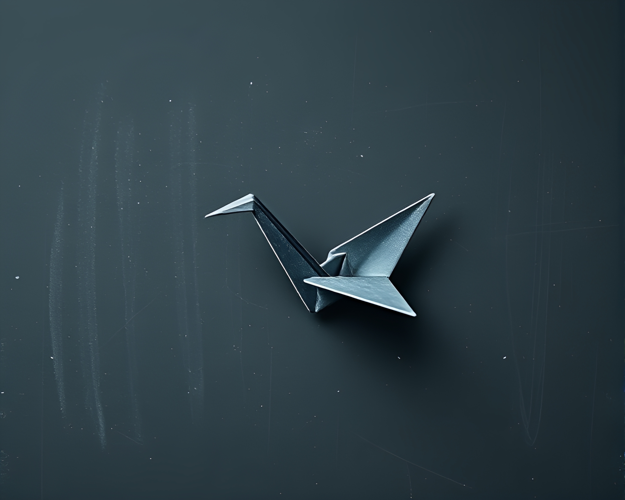 Cinematic Origami Crane on Chalkboard with Gray Palette – free AI stock image