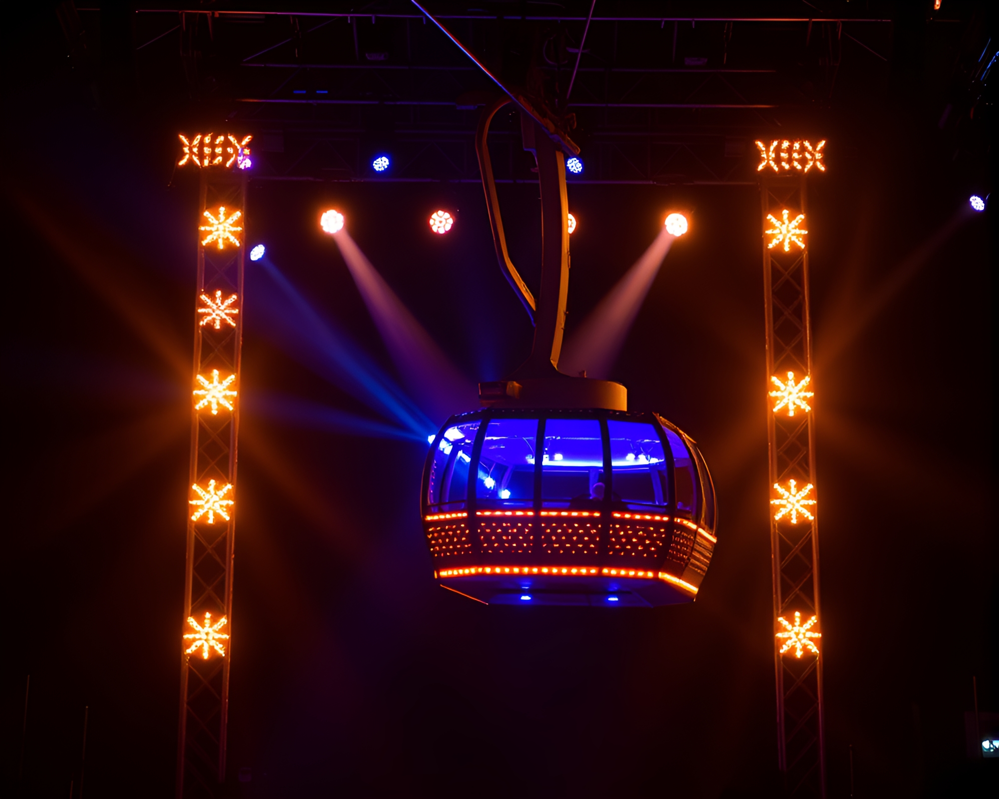 Gilded Gondola Lift Amid Concert Stage Lights – free AI stock image