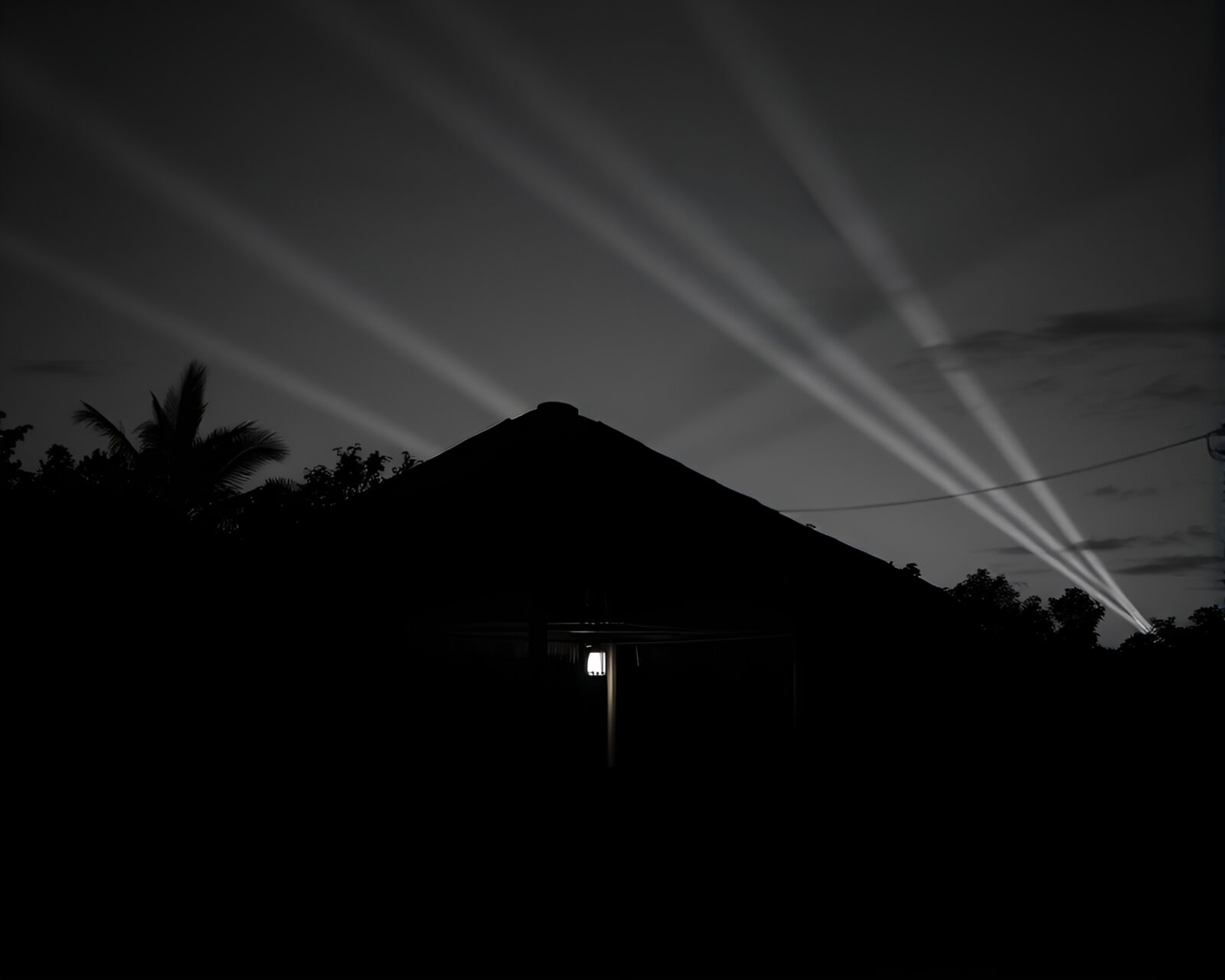 High-Contrast Noir Style Image of Bamboo Hut in Twilight