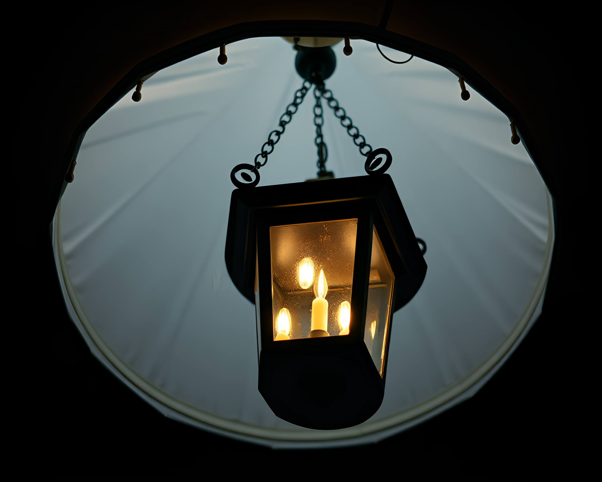 Elegant Chandelier Illuminated by Lantern Light at Tilted Angle – free AI stock image
