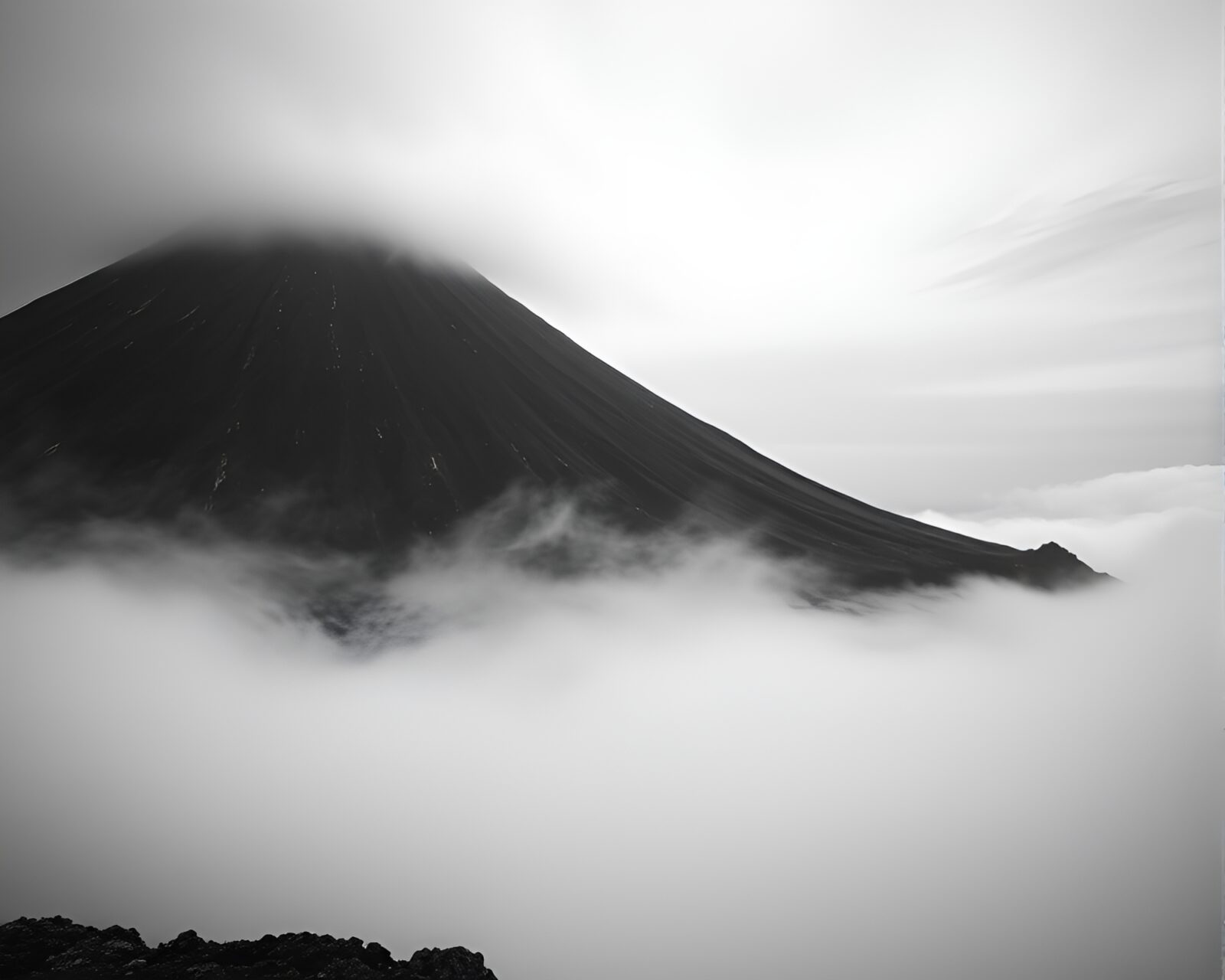 Infrared photo of desaturated volcanic island with holographic specks