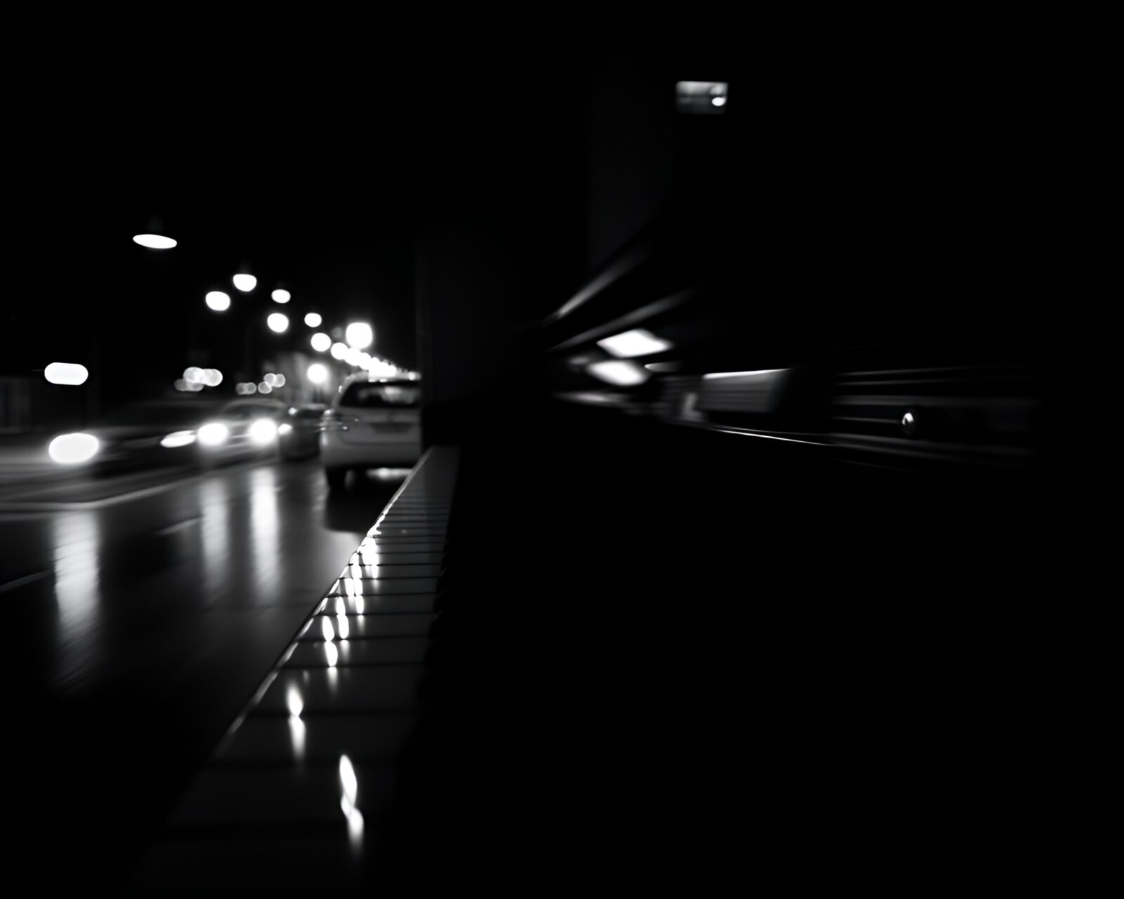 A dramatic double exposure image of two pianos in high contrast lighting