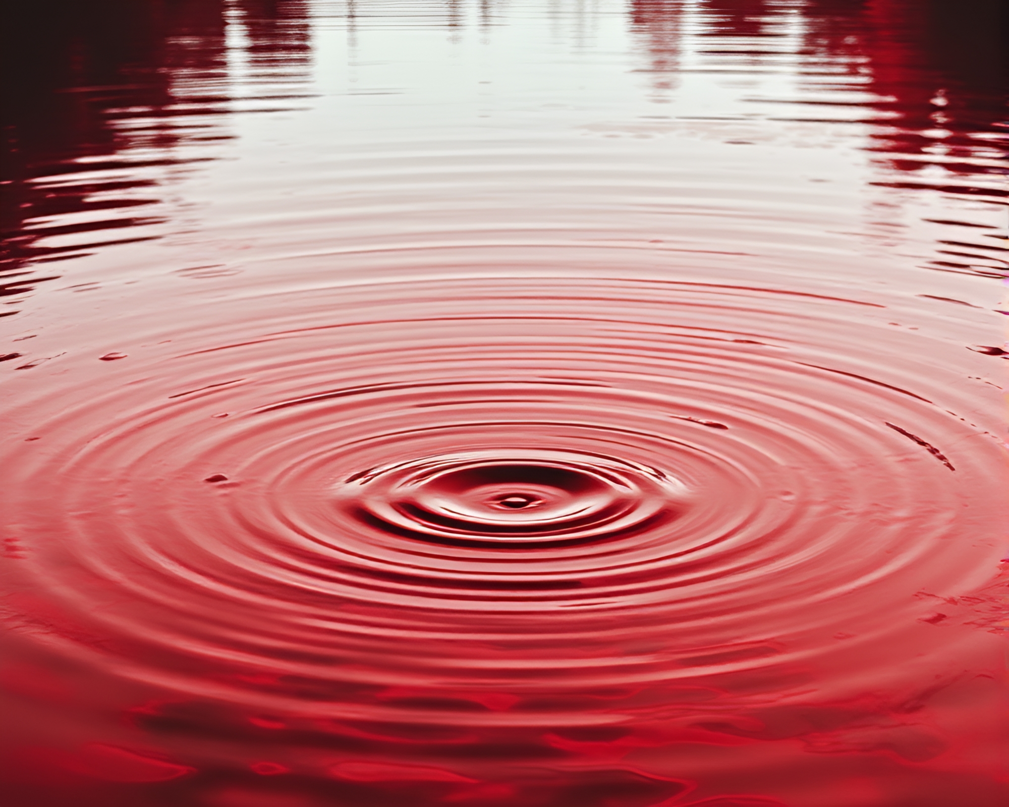 Android reflecting in monochrome red water ripples – free AI stock image