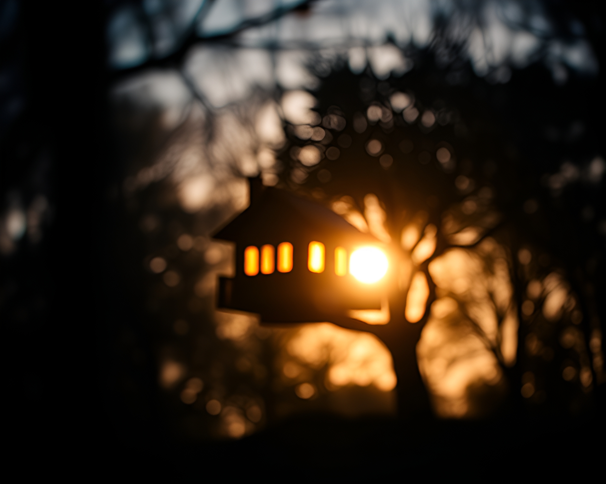 Enchanting Treehouse Retreat with Mosaic Backlit Silhouette – free AI stock image