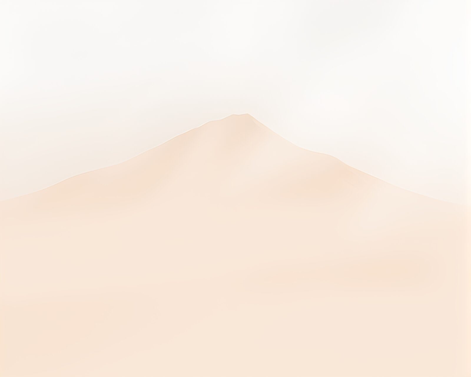 Surreal image of torn paper revealing misty mountains