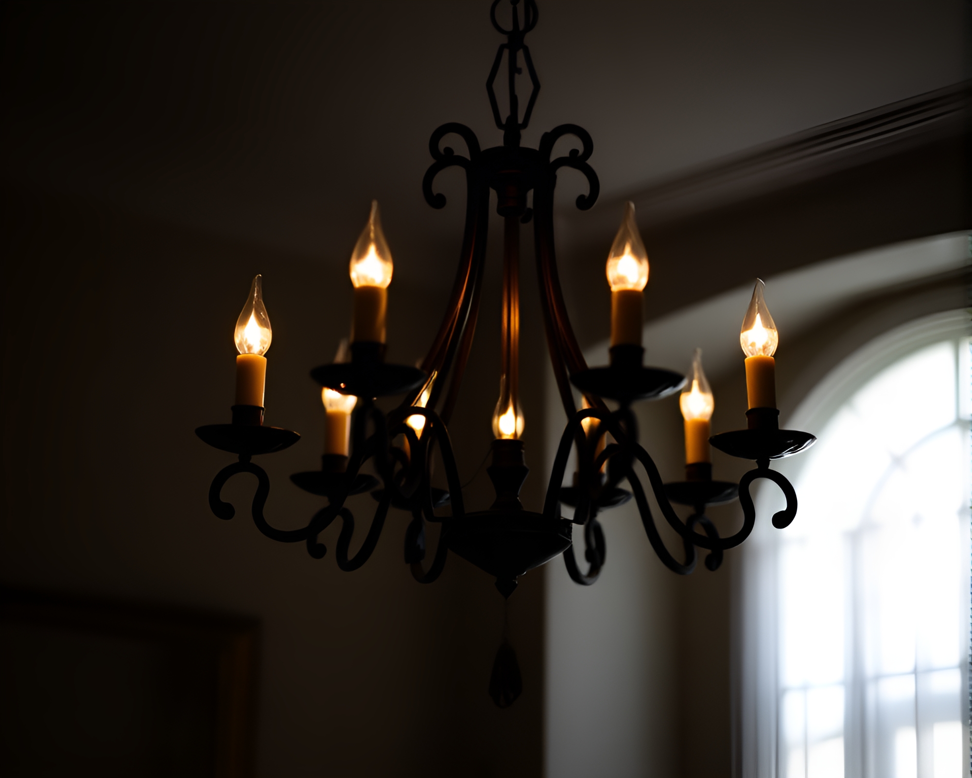 Elegant Chandelier Silhouetted Against Candlelit Shadows – free AI stock image