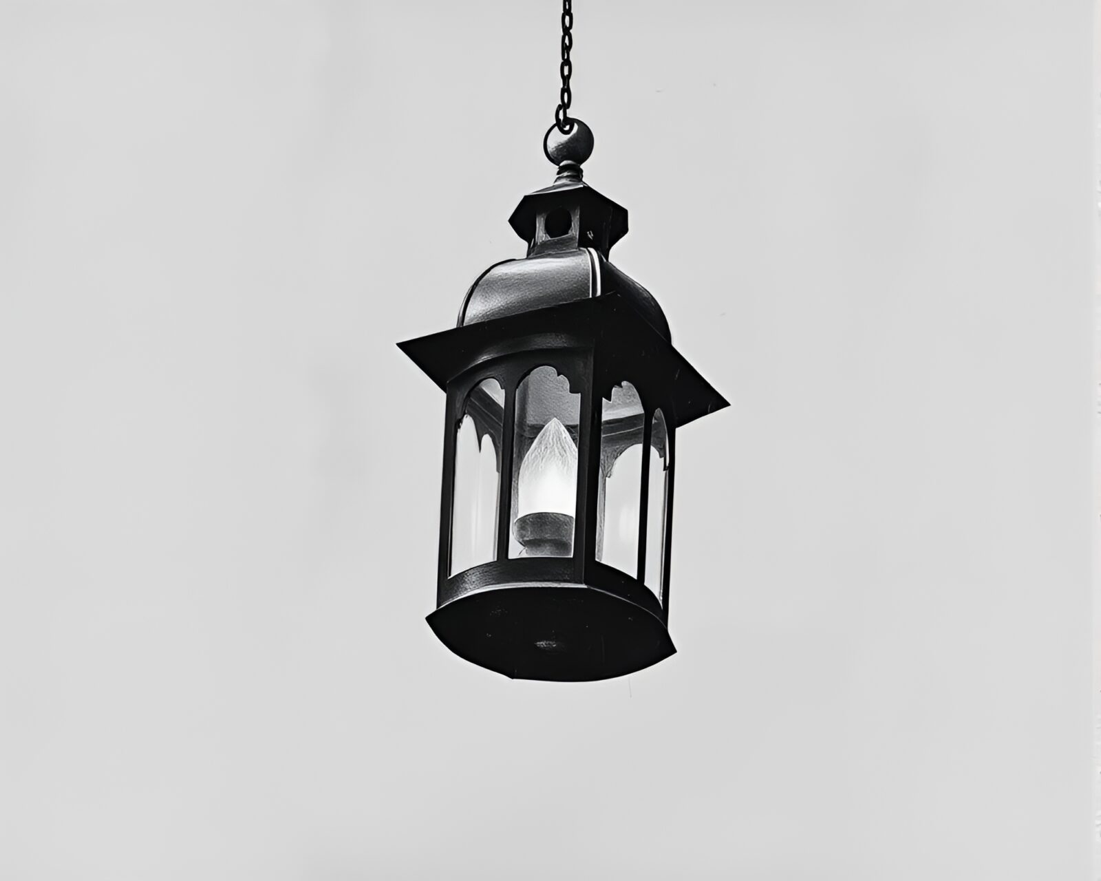 Tilted dadaist art of lanterns in graphite hues.
