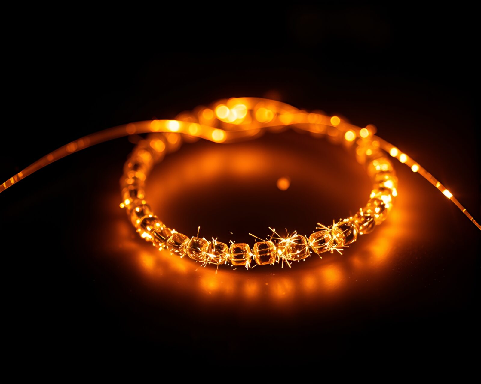 Ethereal neon bracelet surrounded by swirling glitter dust trails