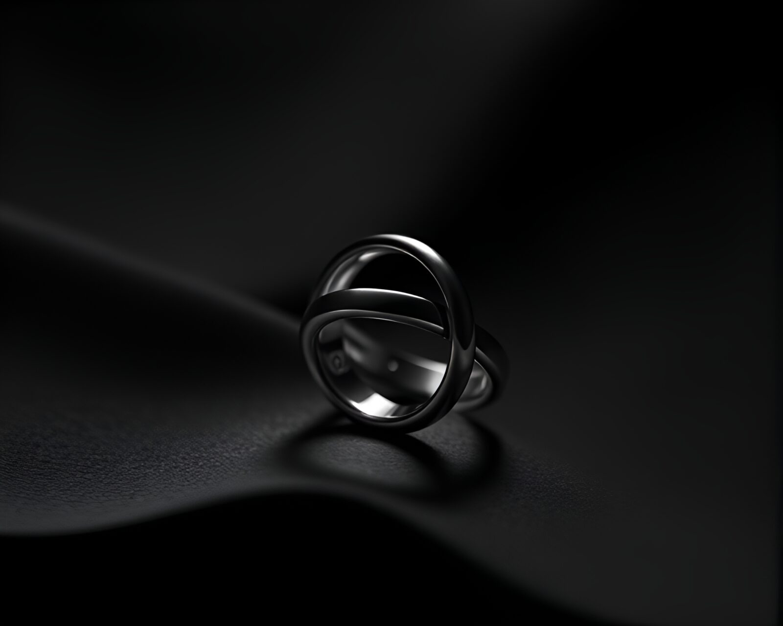 Minimalist high-contrast noir image of a shimmering ring
