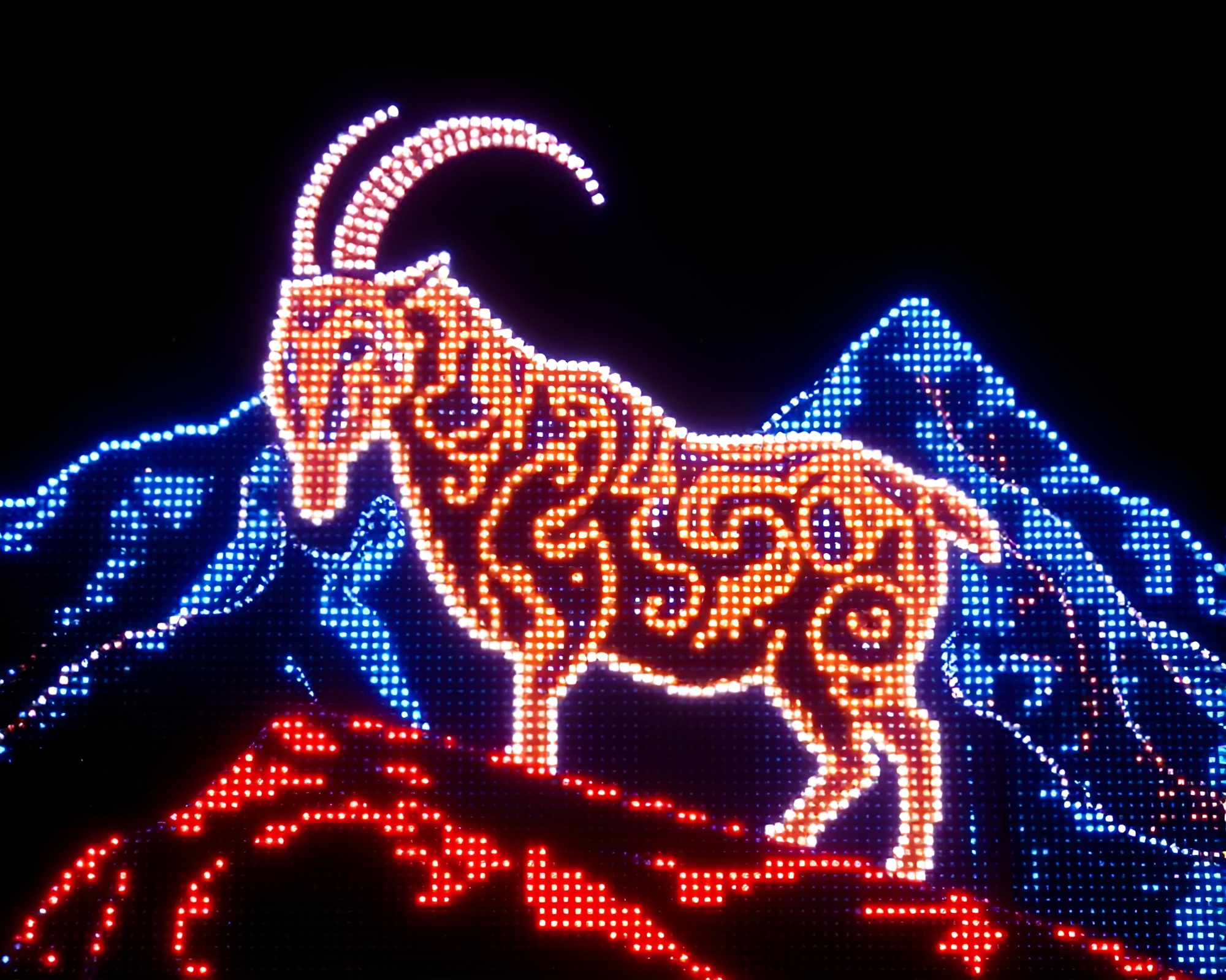 Pixelated Mountain Goat in Mosaic Light Show – free AI stock image