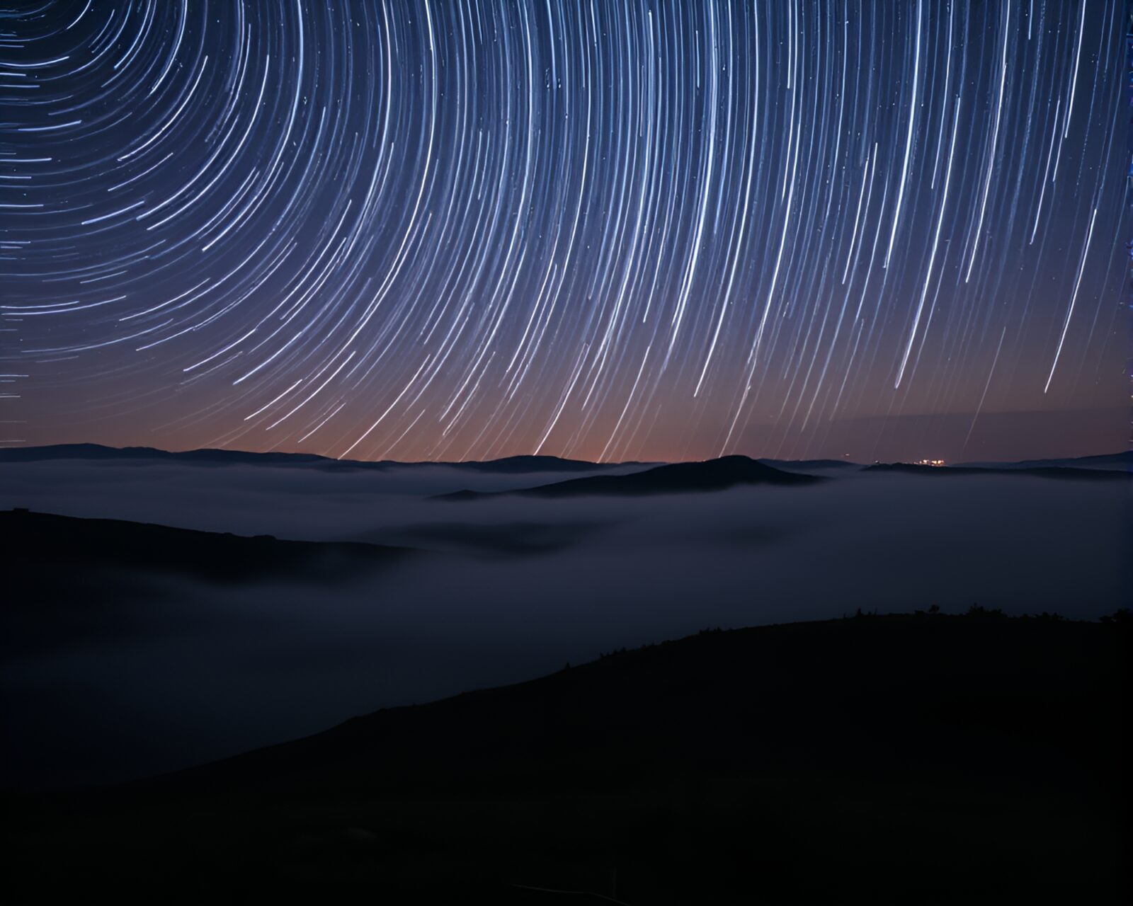 Mist-covered microscope revealing intricate star trail patterns