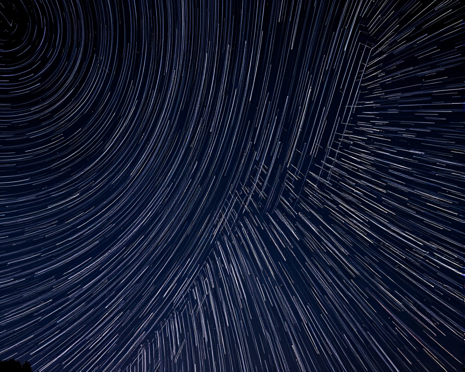 Majestic Leviathan in night sky with trail of sparklers
