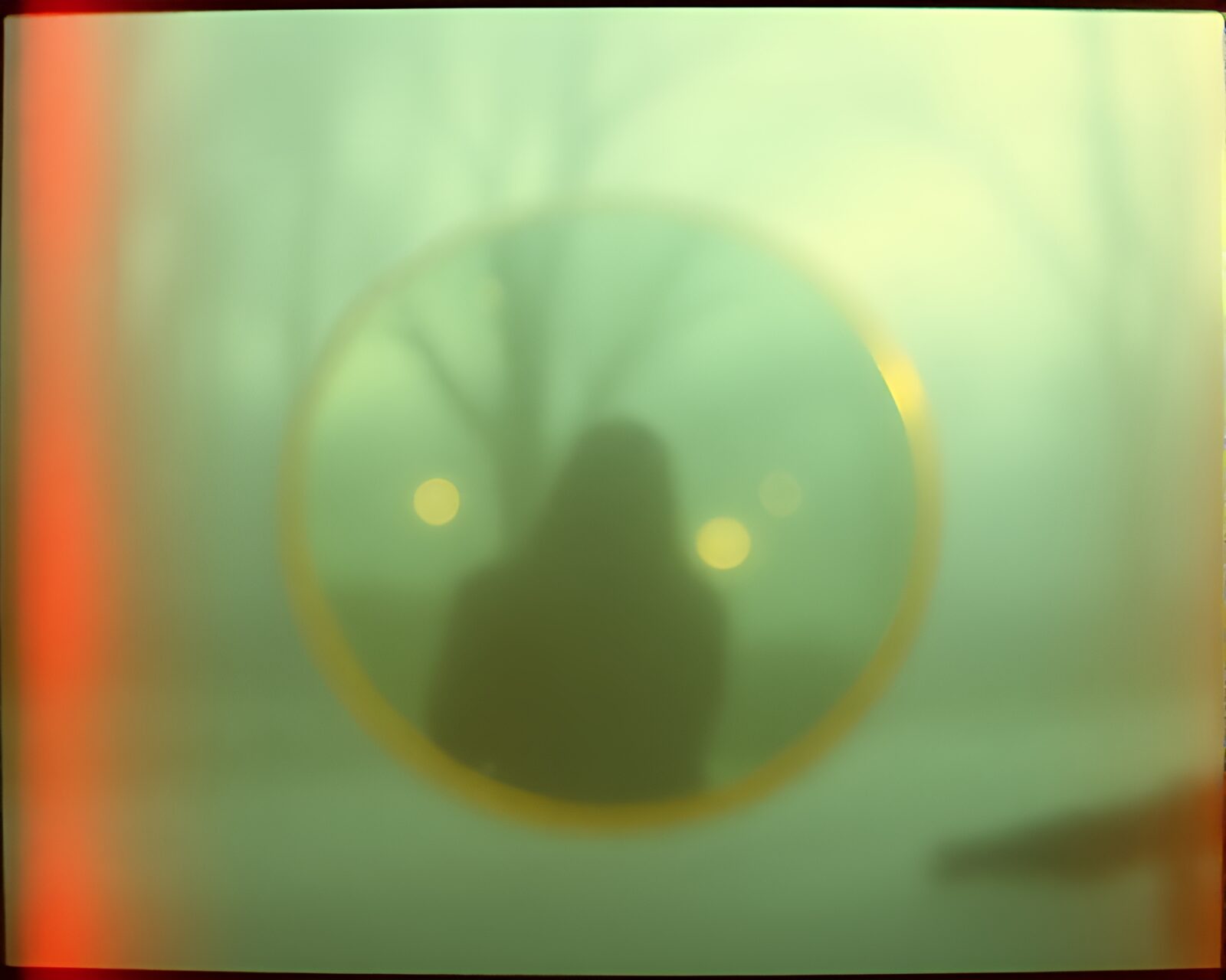 Glowing ring reflecting hazy lights in retro film style