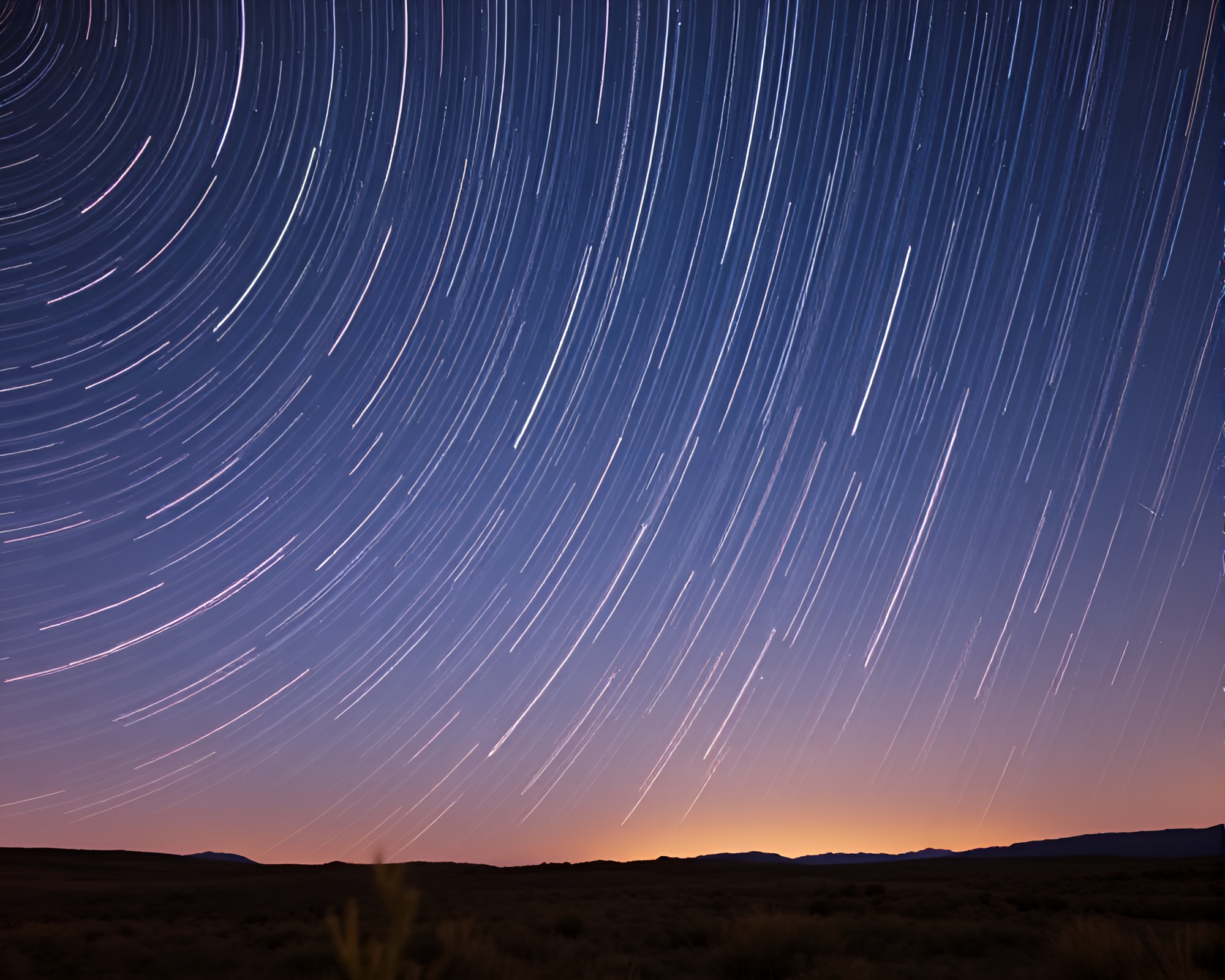 Illuminated Obelisk: Star Trails and Rose Gold Light Painting – free AI stock image