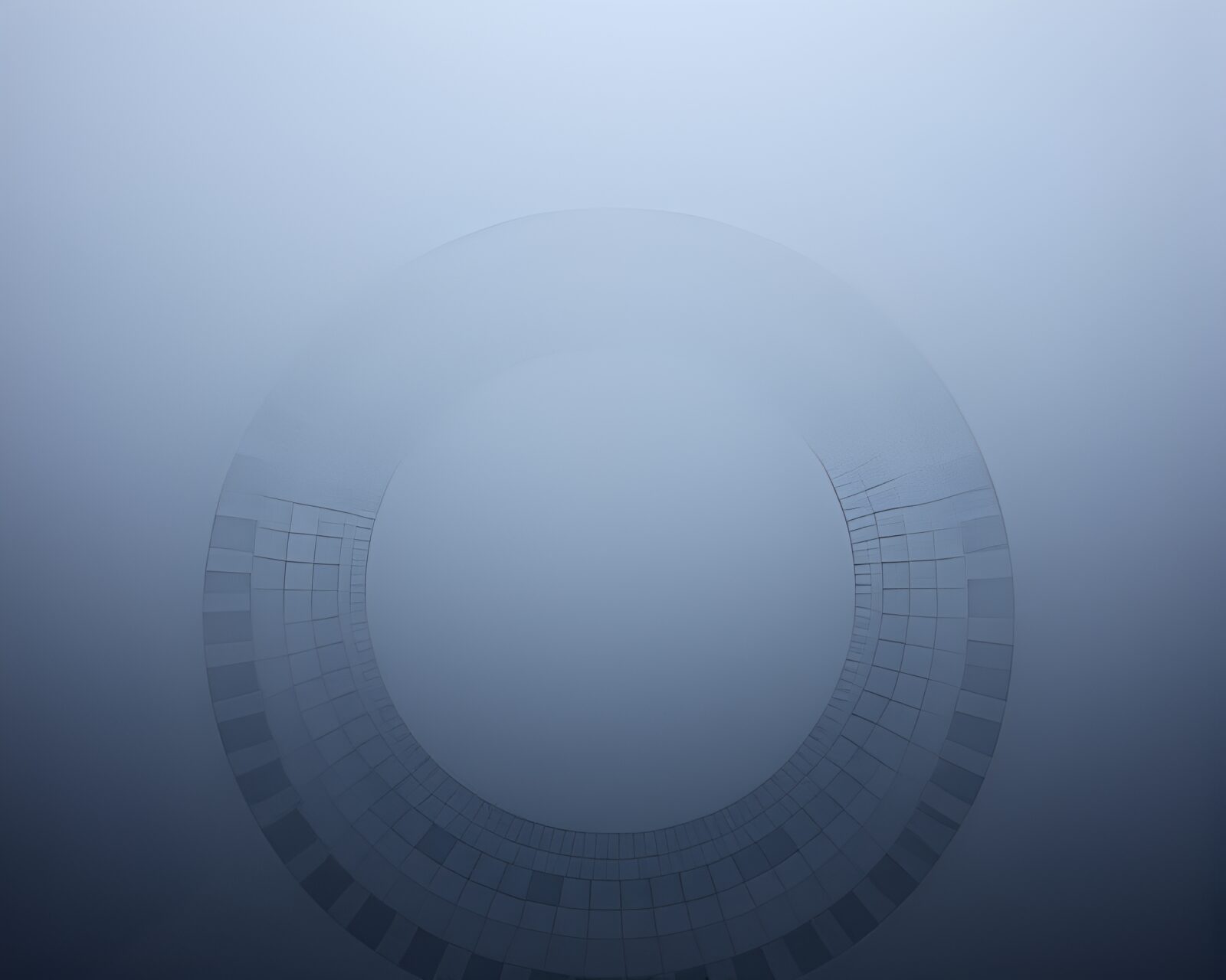 Concentric circles surrounded by sacred geometry in foggy light