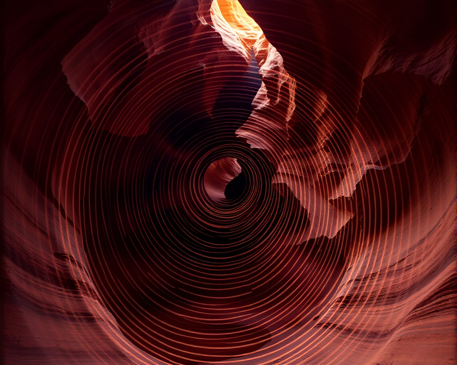 Swirling fingerprint patterns surrounding luminous crystal in canyon setting
