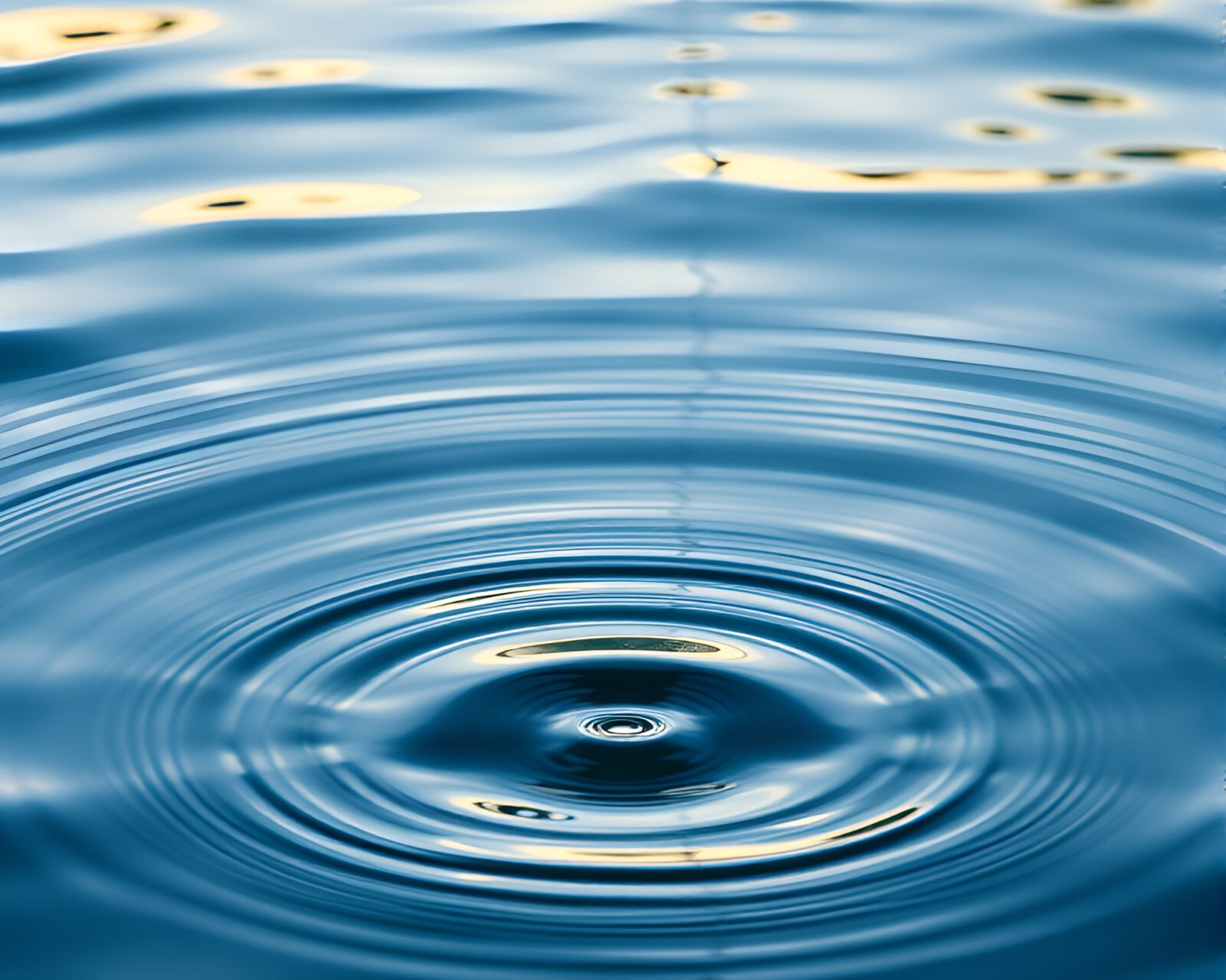 Lithographic style image of camera with water reflection ripples