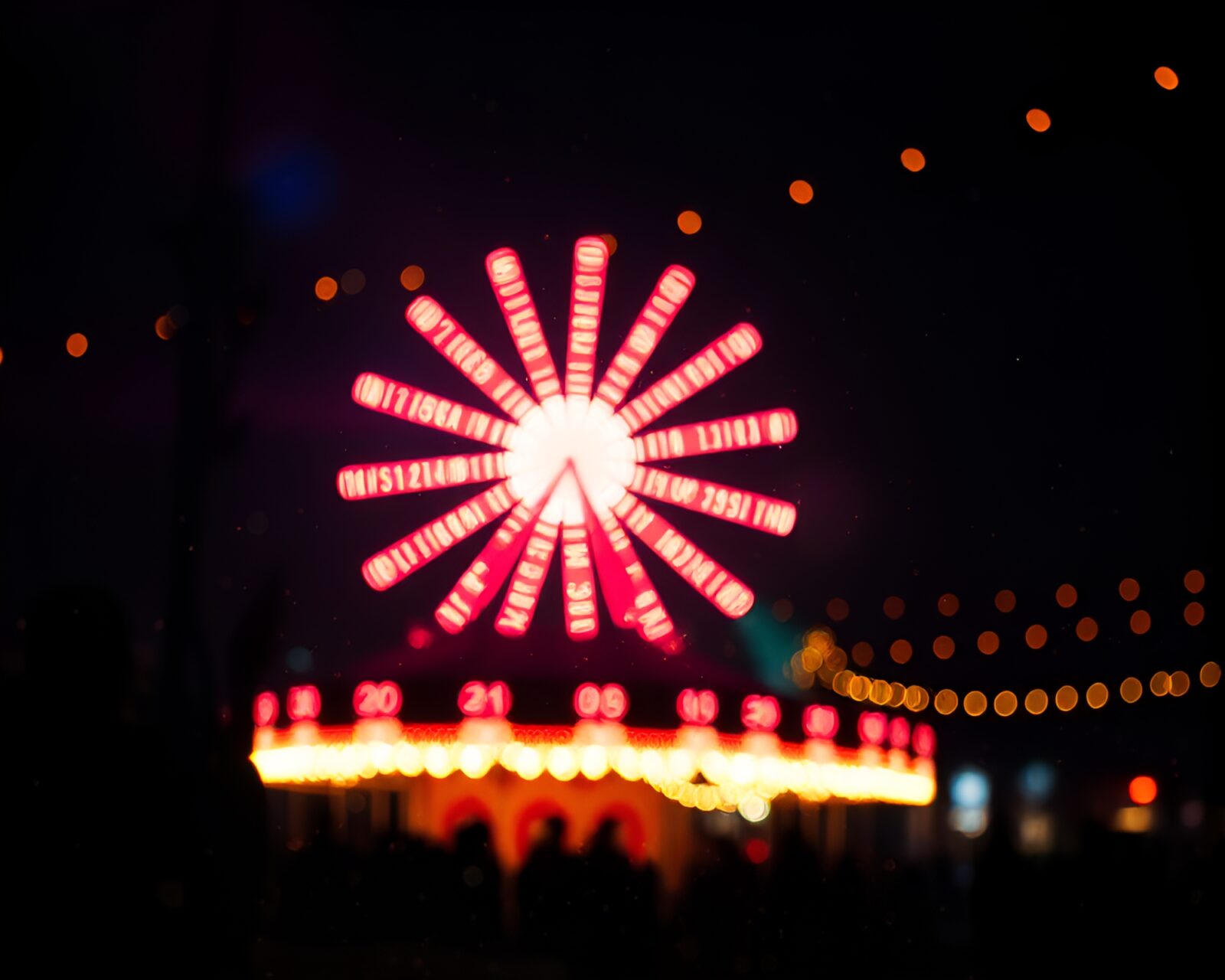 Colorful carnival lights illuminating an intricate Morse code telegraph