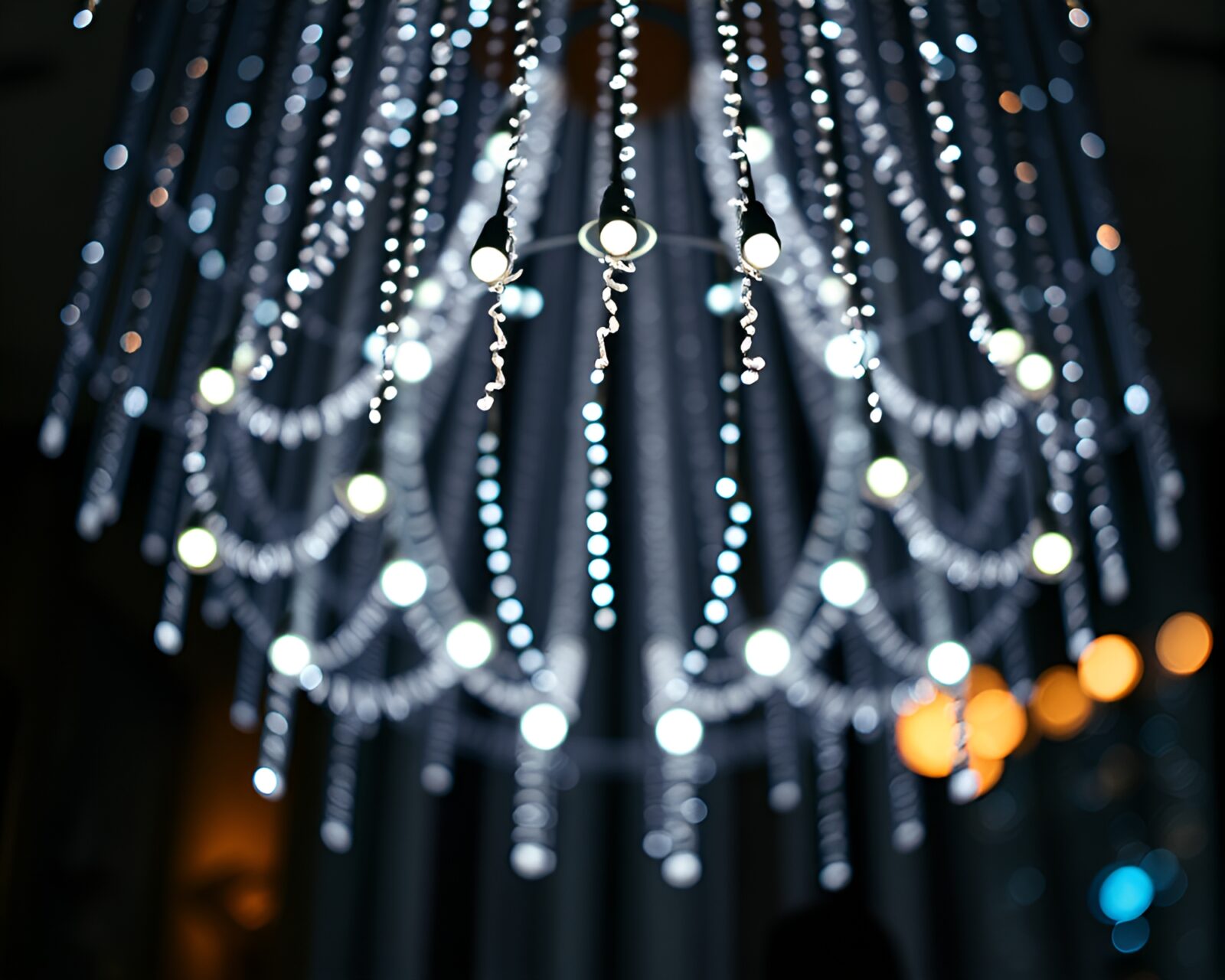 A mesmerizing LED chandelier with pixel grid patterns in an engraved style