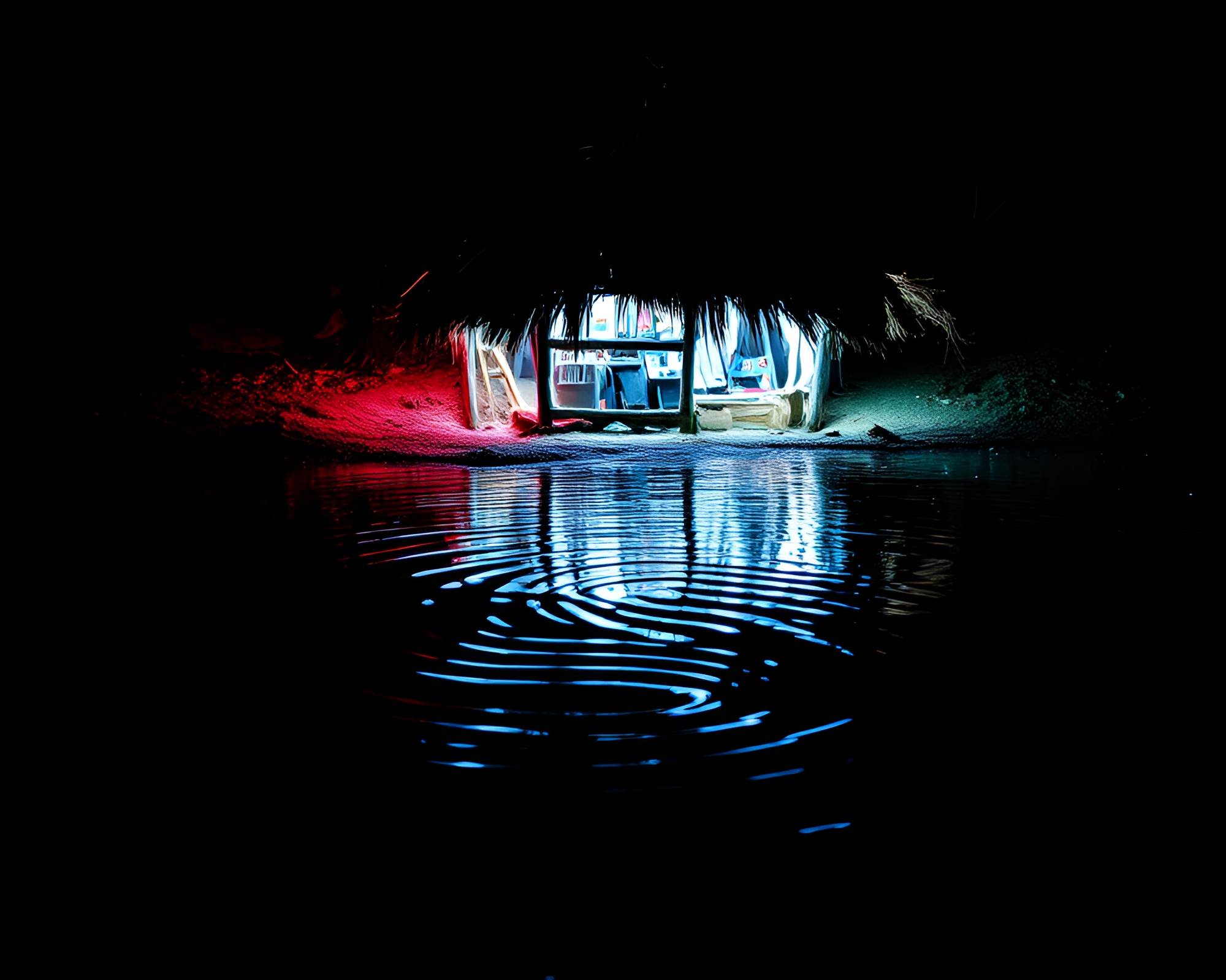 Glowing Mud Hut Reflections at Water’s Edge – free AI stock image