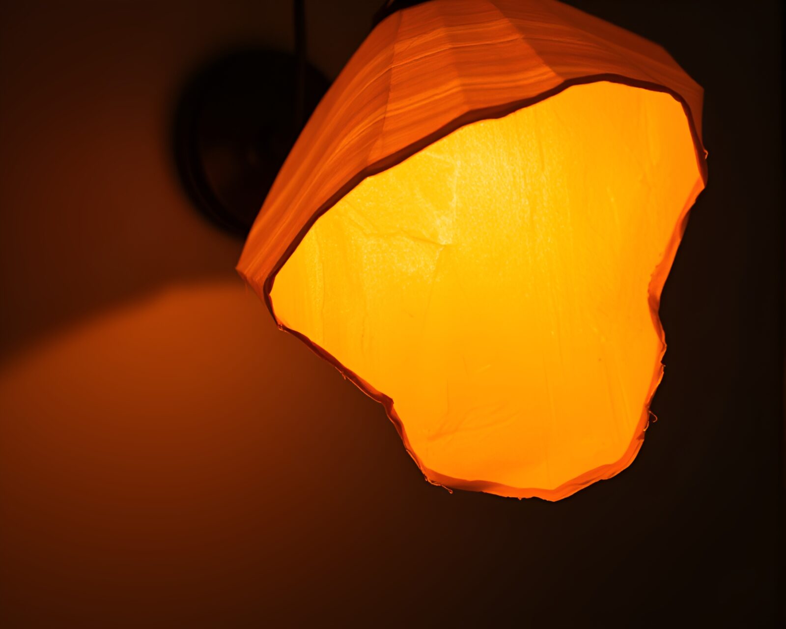 Elegant lamp illuminating a room with dramatic highlights