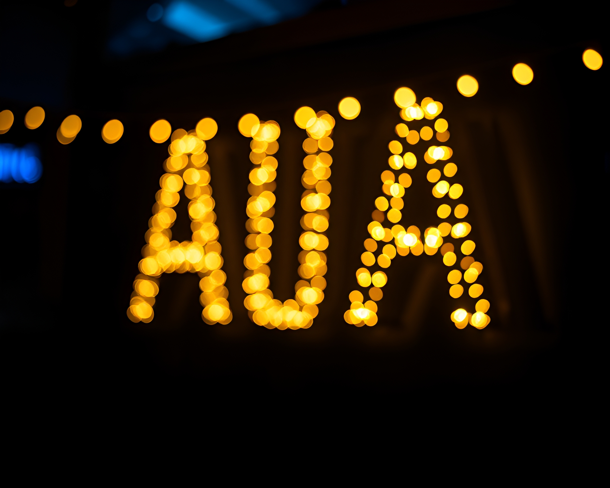 Enigmatic Runic Alphabet Amidst Dutch Angle Bokeh Lights – free AI stock image