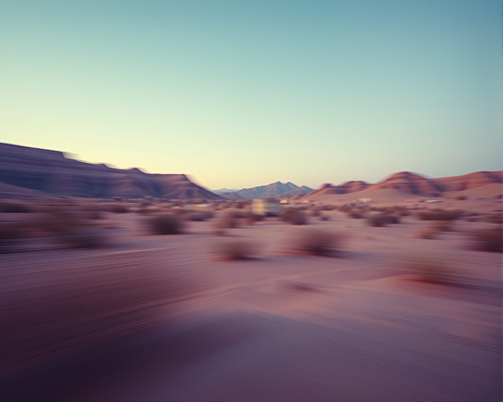 Pan motion blurred desert landscape with lens vignette