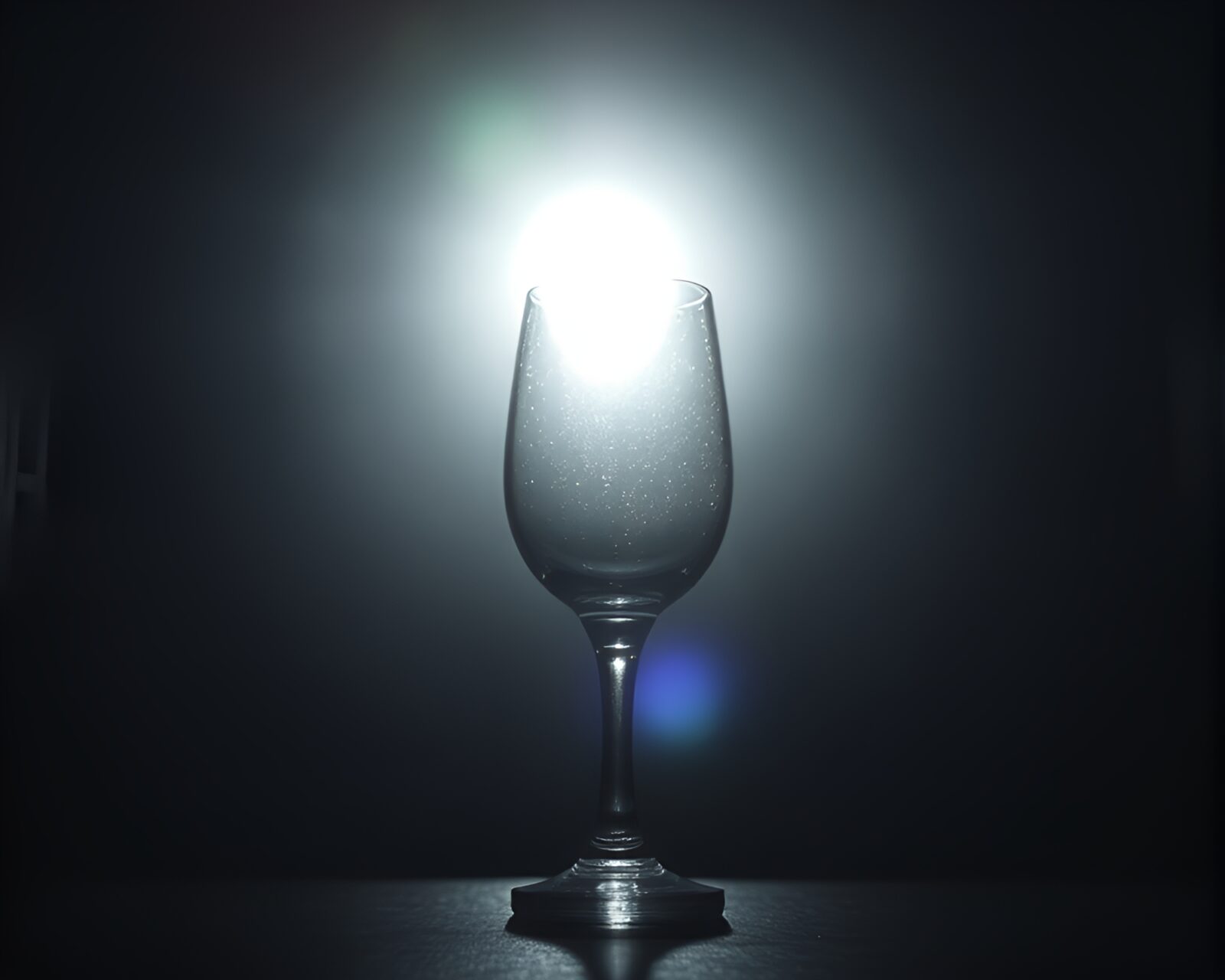Backlit lamp silhouette with glass distortion and bokeh effect