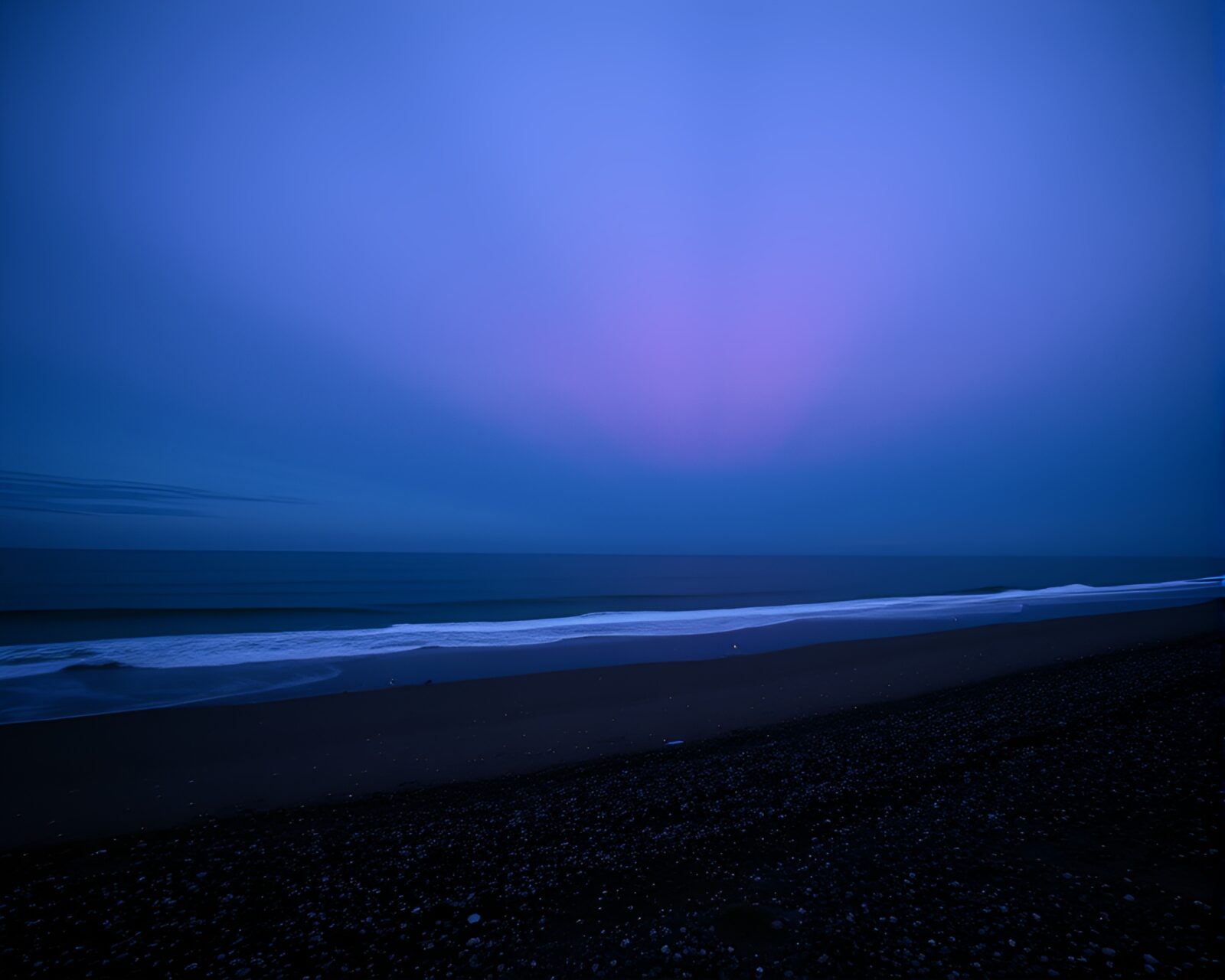 Grisaille composition of beach scene with colorful sparkler trails