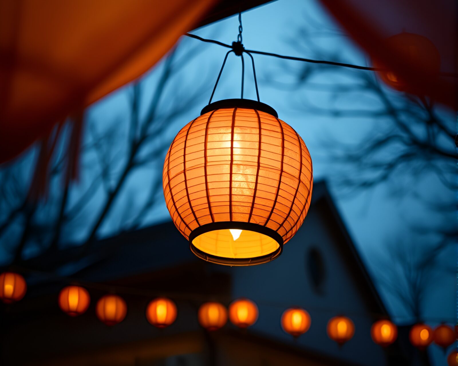 Surreal composition of glowing paper lantern in sky