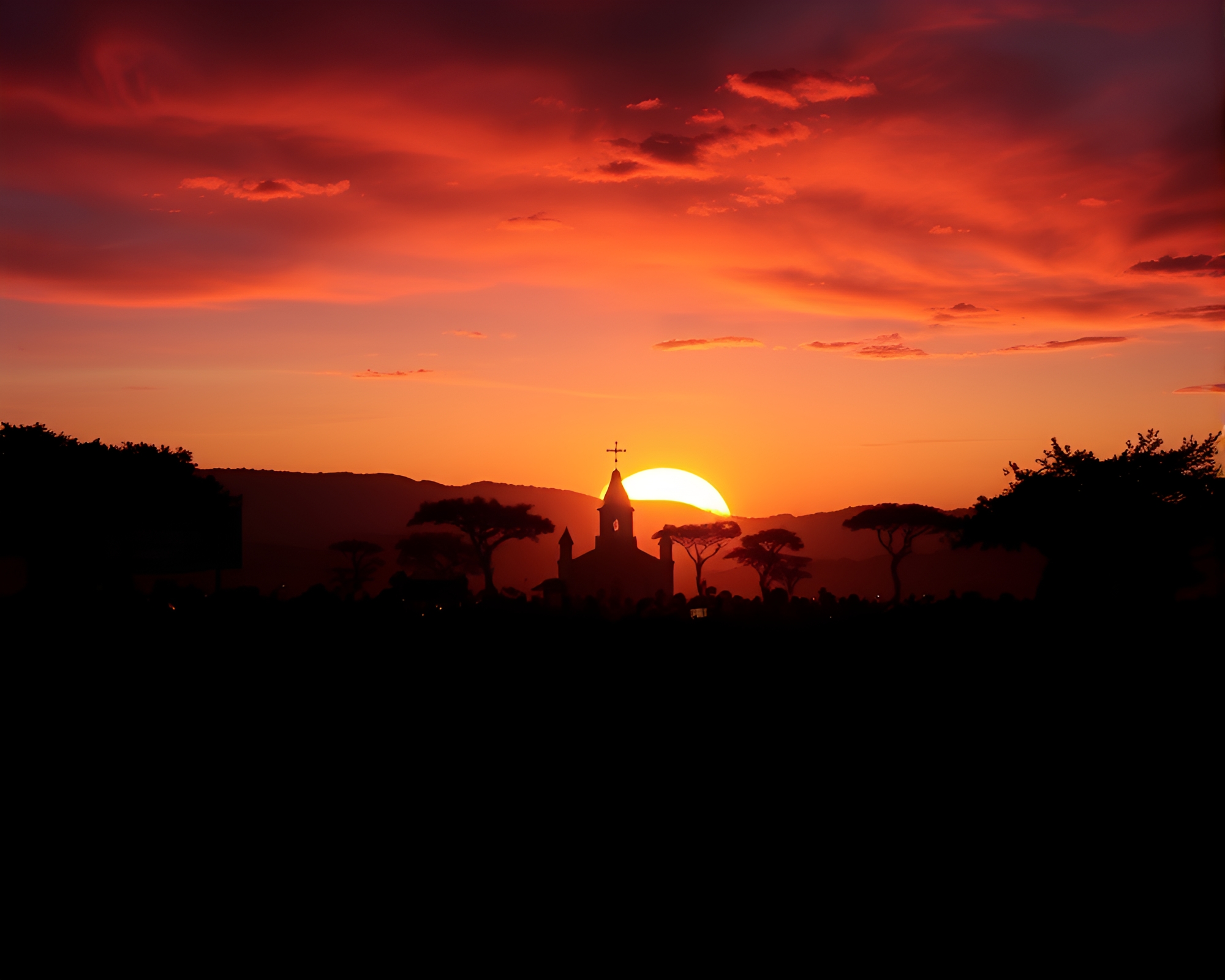 Savanna Sunset with Silhouetted Crowd at Candlelit Church – free AI stock image