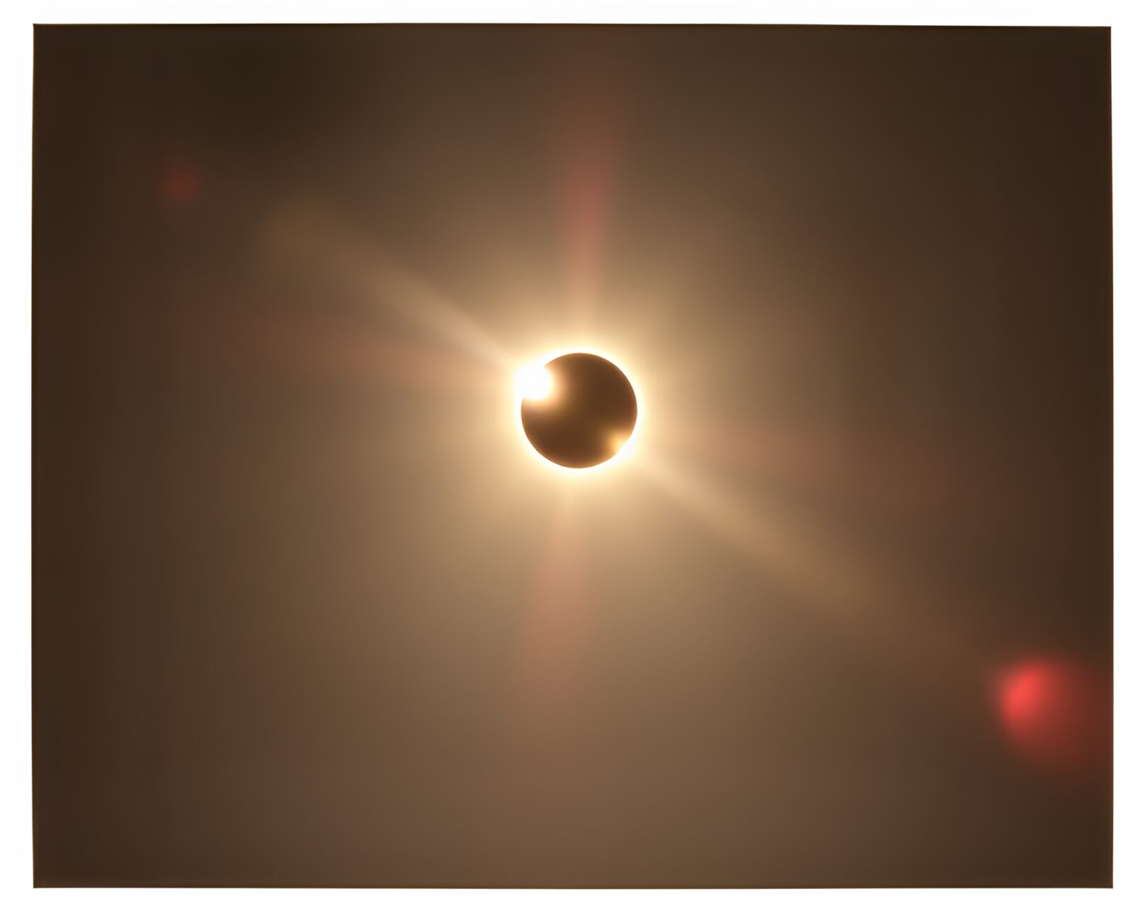 Polaroid-framed image of solar eclipse within Fibonacci spiral