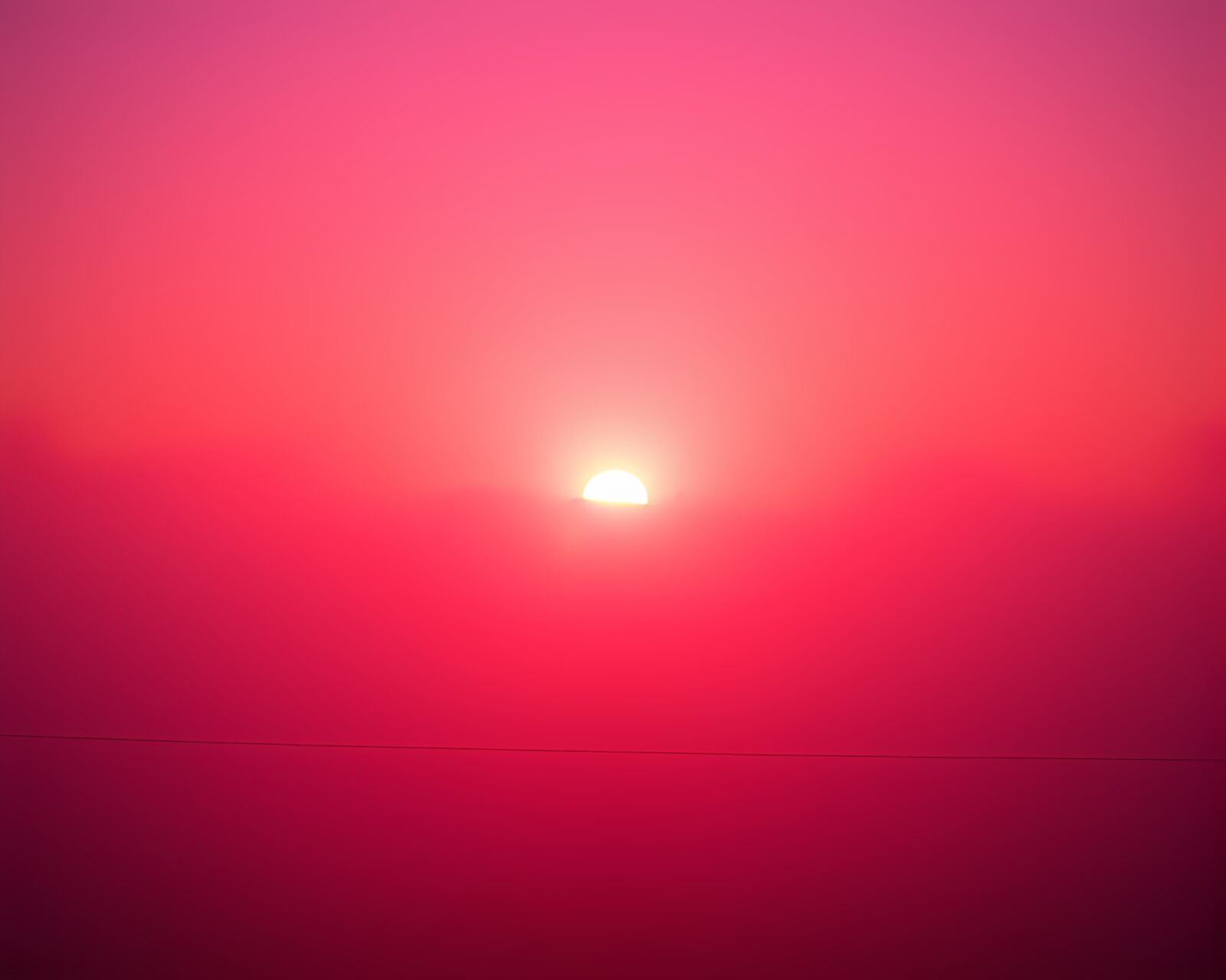 Ethereal sunset with neon lights in foggy city setting