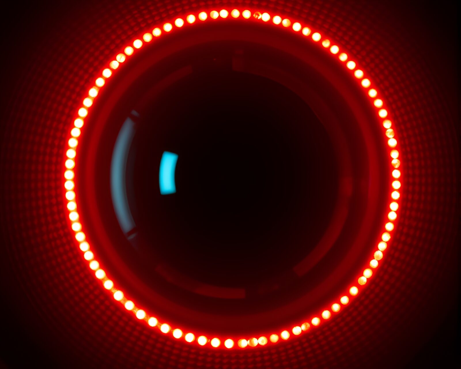 Futuristic halftone grid with glowing sapphire smart contact lens