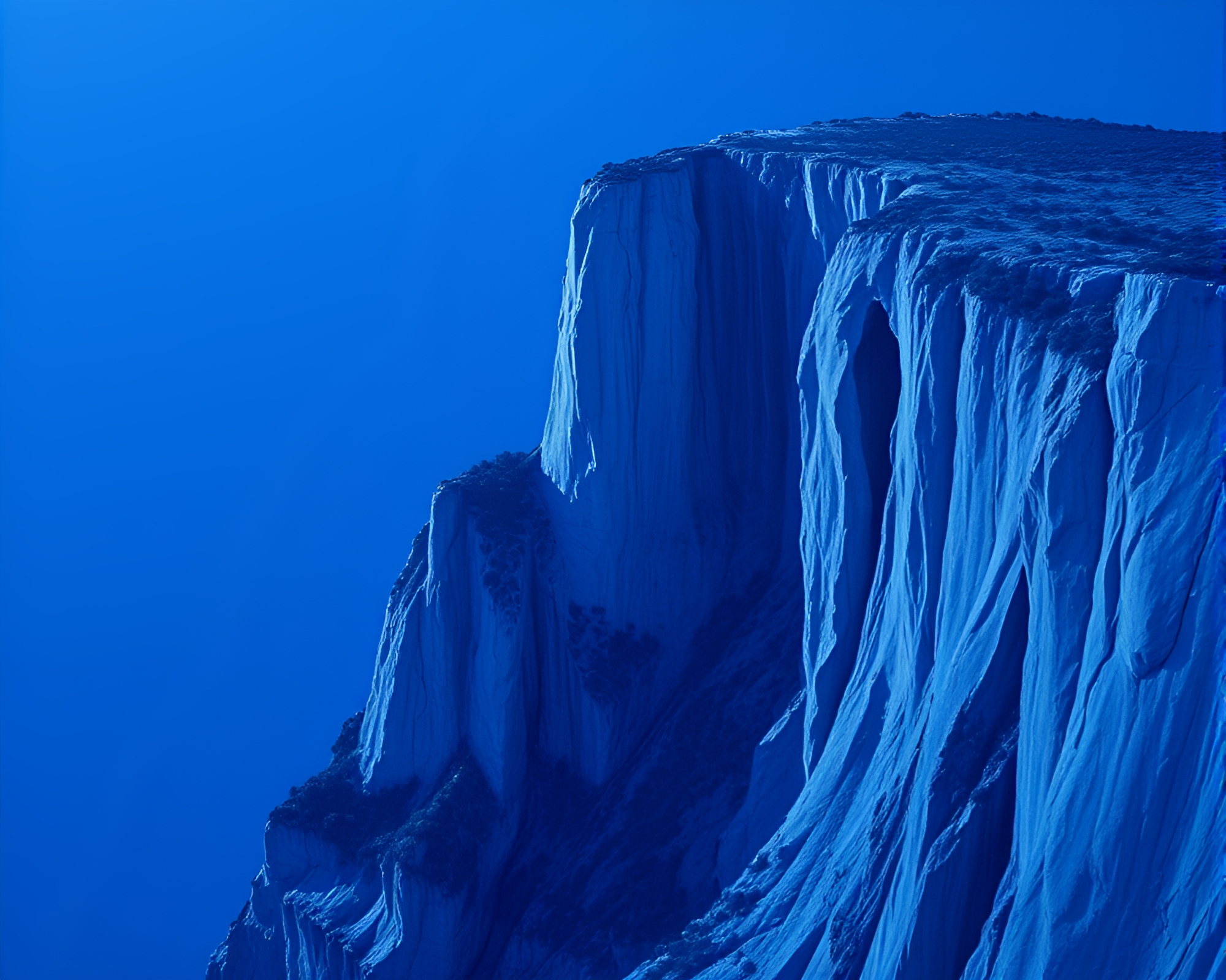 Dynamic Cliff Monochrome Blue Matte Painting – free AI stock image