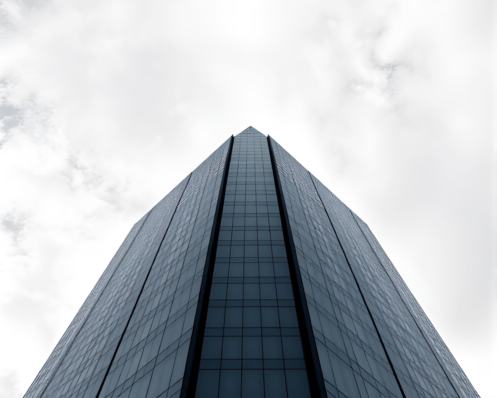 Glimmering Skyscraper Reflection in Monochrome Blue – free AI stock image