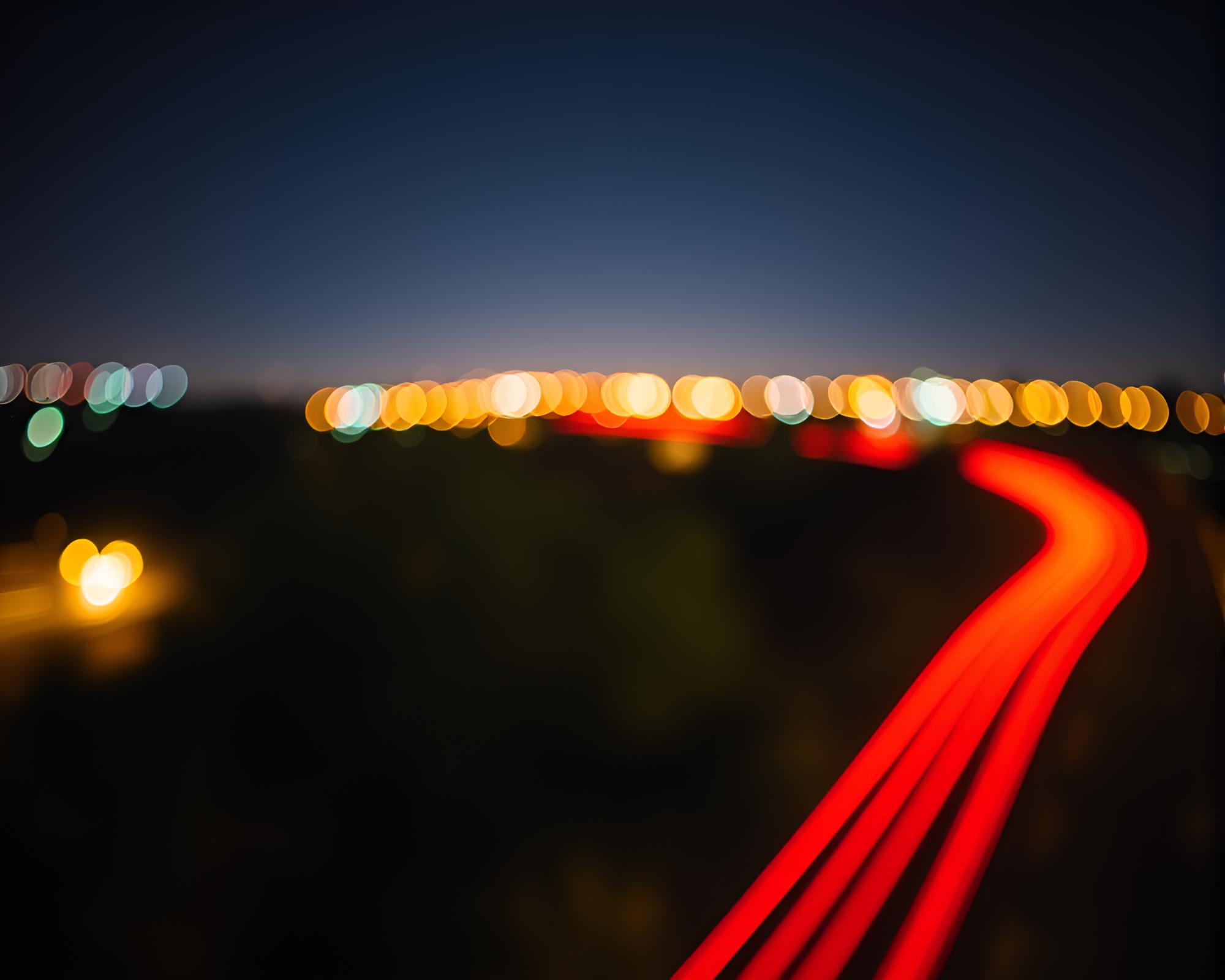 Vibrant Oasis Light Trails Under Low Range Sky – free AI stock image