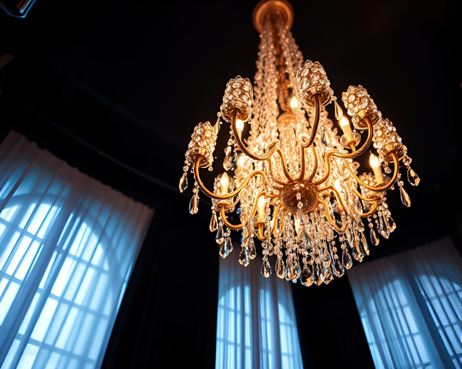 Fisheye view of a sparkling metallic chandelier under soft lighting