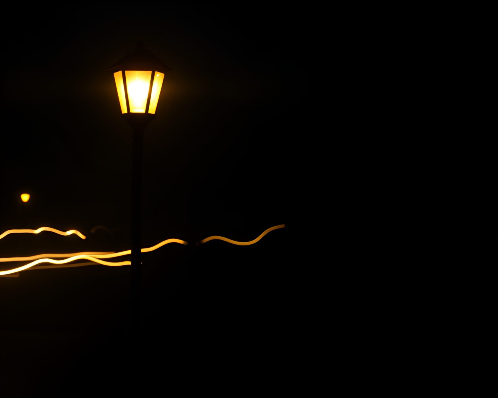 Lantern light trails creating rim lighting in shadowy ambiance