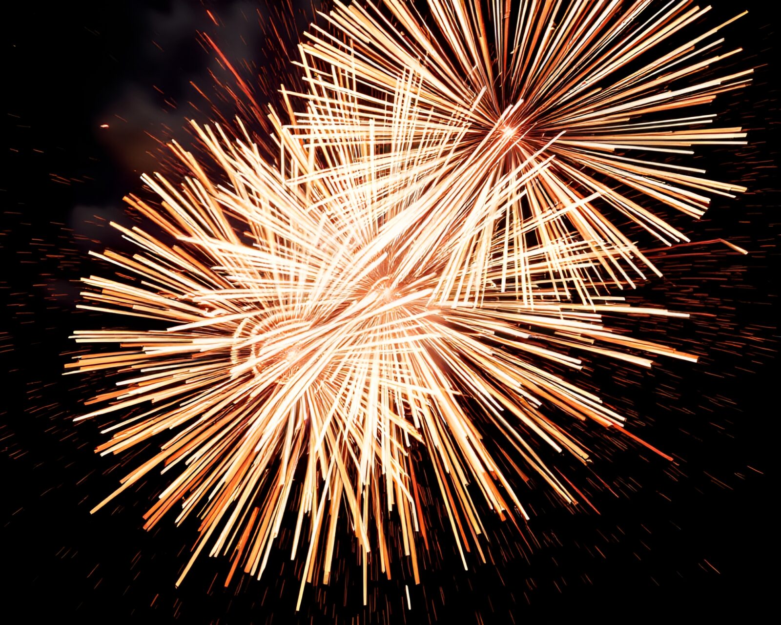 Vibrant fireworks display amidst digital glitches and sparkles