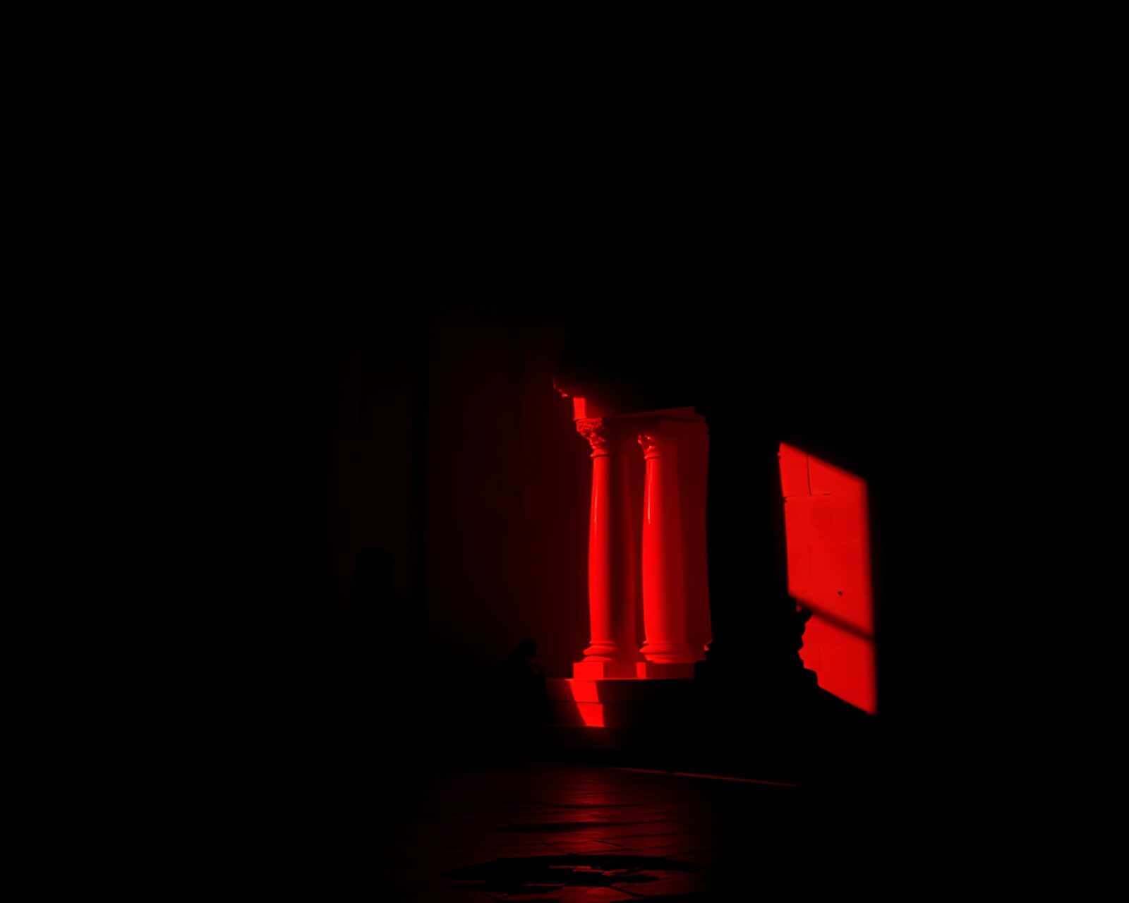 HDR photograph of shadowy temple glowing in rich ruby tones